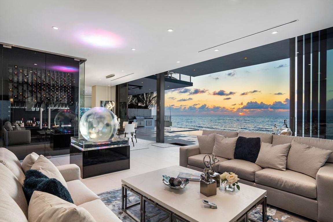 After a wildly successful career of making (and entertaining) real estate markets, Frank McKinney offers his FINAL oceanfront masterpiece, 3492 South Ocean. McKinney's stunning tropical modern creation, situated 20 feet above sea level, showcases:  Tropical Modern Design • 5 Bedroom, 5 Bathroom •  Direct Oceanfront Home • 11,000 year-old Azure-Blue Lava Kitchen Countertops from France • 1,270 sq.ft. Oceanfront Master Suite 31 feet Above Sea Level • 3-story Oceanview Glass Elevator encased in a Glass Wine Room & Bar • Indoor Jellyfish Sphere with Touch Tank (only one in a private home) • 50 foot Disappearing-Edge Resort-Style Pool • Rooftop Lounge 44 feet Above the Sea • Cascading Water Wall • Reflecting Pool with Shimmering ''Walk over Water'' Oceanfront dining, family and living rooms, oceanfront office off master suite, Ipe deck cantilevered over beach, 2 outdoor oceanfront and entertaining kitchens. McKinney's stunning tropical modern creation carries the powers of nature (earth, wind & fire) and is simply beautiful!