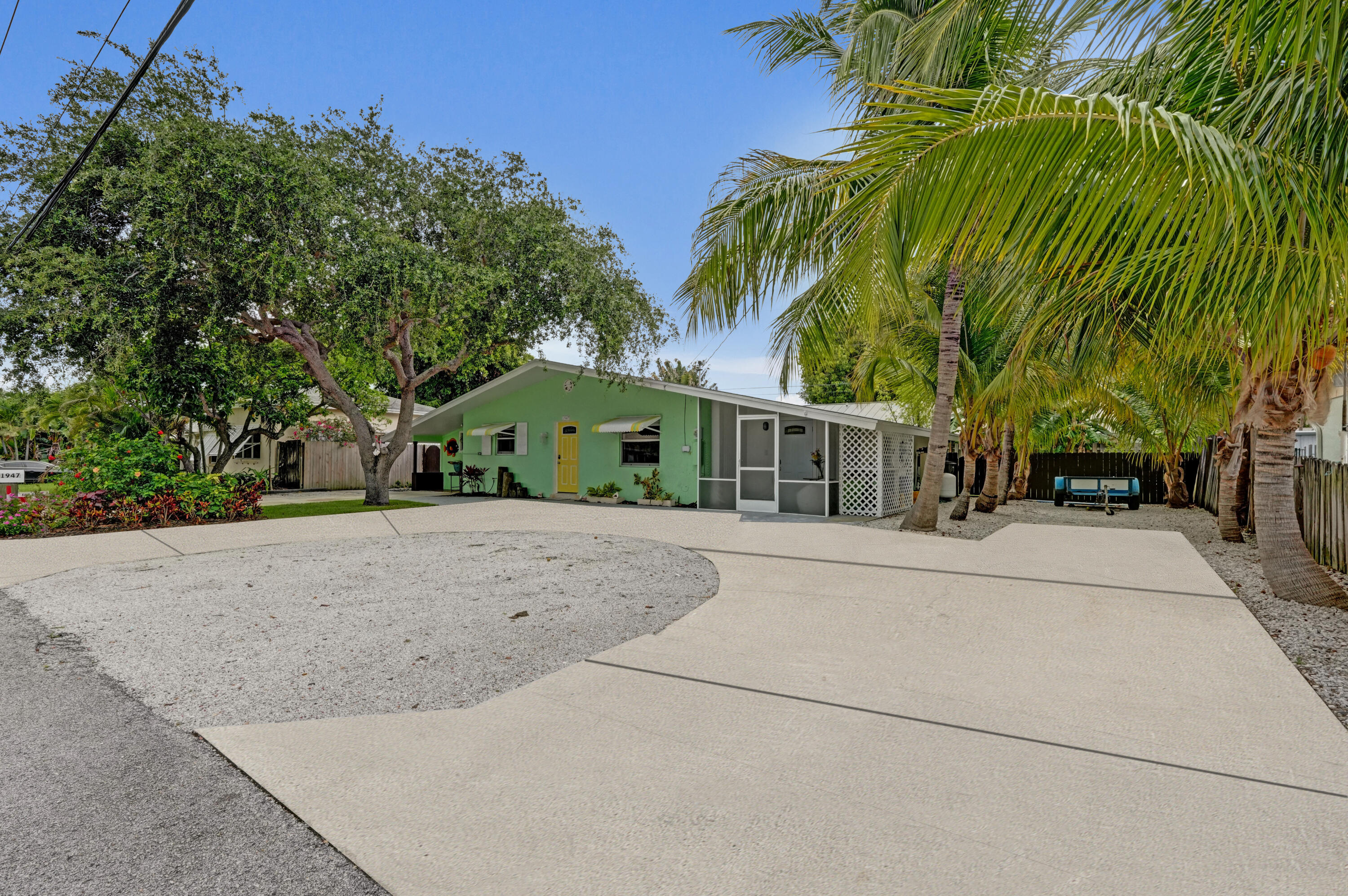 Nestled minutes from the beach in a non-HOA community, offering an excellent opportunity for investors or owner-occupants seeking a multi-unit income-producing asset or a live-and-rent opportunity. The thoughtful layout maximizes usable space across the three connected units, making efficient use of every square foot. Features all-new electrical throughout, a recently installed water softener and water purification system, mature fruit trees, and additional storage space for a boat, trailer, or RV. Located in the prime location of Juno Ridge in close proximity to PGA Blvd and the beach, this triplex stands ready for beginning or adding to your investment portfolio! May be sold together with parcel 00434204080000060.