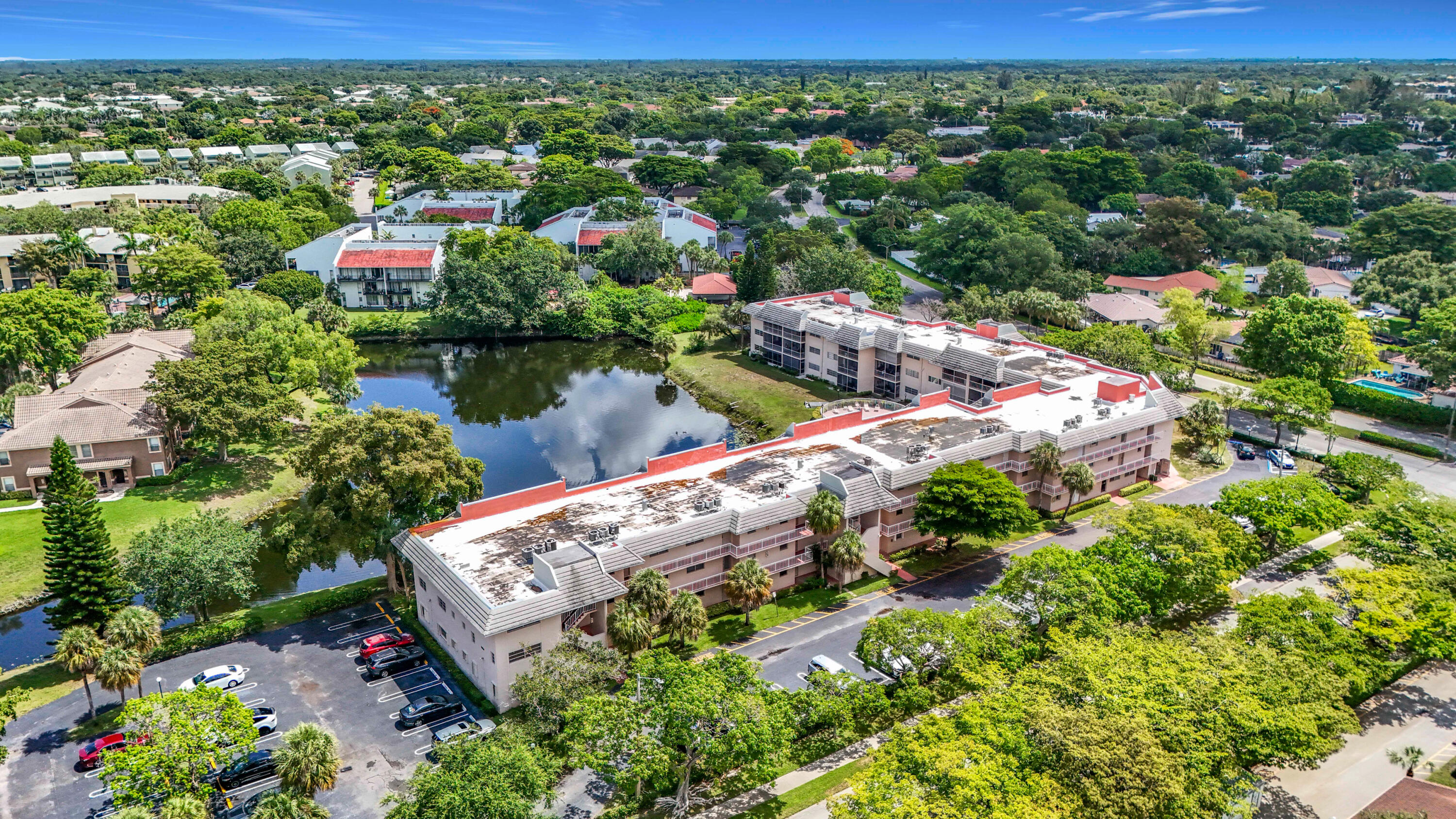 Poolside Opportunity in Coral Springs! Spacious 2BR/2BA condo located in the Lake Forest community featuring expansive lake and pool views, a large living/dining area, abundant natural light, an enclosed screened balcony, generous bedrooms, and ample storage throughout. The functional kitchen offers plenty of cabinetry and workspace. The primary suite includes a walk-in closet and private bath. Community amenities include a waterfront pool, beautifully maintained grounds, and assigned parking. Centrally located near shopping, dining, parks, entertainment, Coral Square Mall, The Walk, and major highways. A fantastic opportunity to update and customize while enjoying one of the community's most desirable water-view locations.