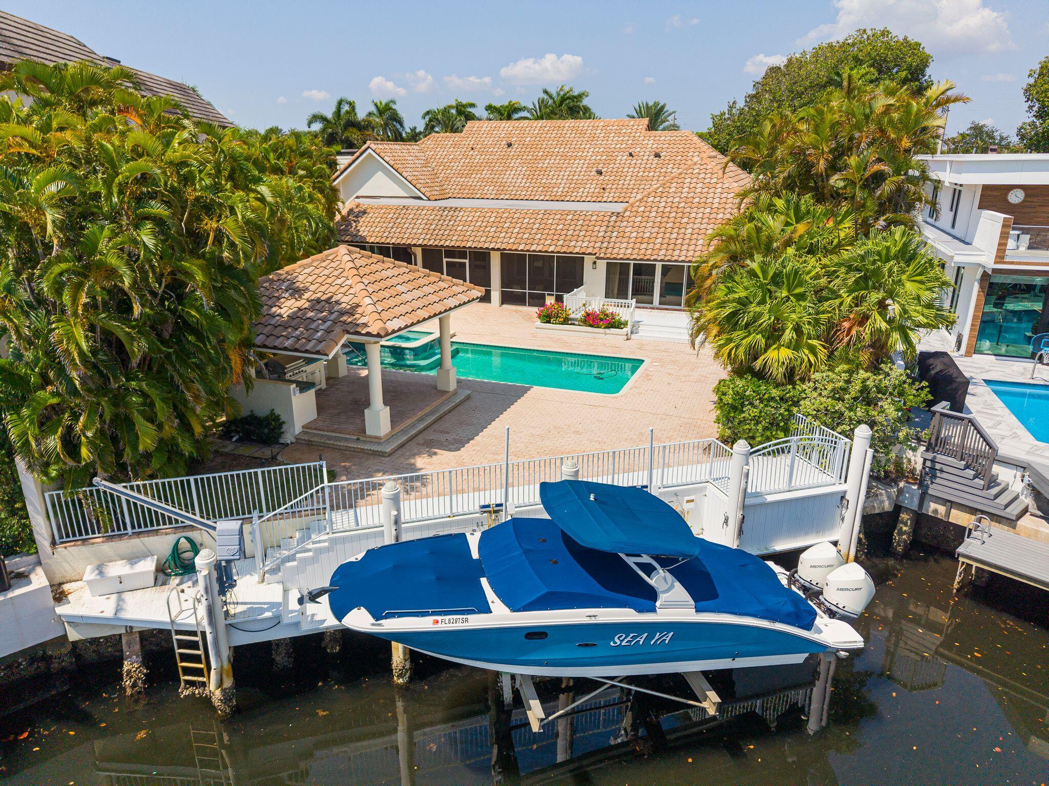 Welcome to The Sanctuary—one of Boca Raton's most coveted and ultra-exclusive waterfront enclaves, renowned for its unparalleled privacy, 24/7 armed gate security, and world-class yachting lifestyle. This sophisticated 4BR/4.5BA estate sits on .44 acres and is gracefully situated on a serene, private canal with direct ocean access and a full-service dock—an exceptional offering for the boating connoisseur. Soaring ceilings, refined architectural details, and an abundance of natural light enhance the elegant, open living spaces. Designed for seamless indoor-outdoor living, the home features a grand screened-in loggia, resort-style pool, and a fully equipped summer kitchen beneath a custom-tiled pavilion. Each bedroom offers a private en-suite bath, ensuring comfort and privacy for family and guests. Residents of this prestigious community enjoy exclusive access to tennis courts, a private park, and impeccably landscaped groundsjust moments from the beach, elite golf clubs, fine dining, and international shopping destinations.

DISCLAIMER: The written and verbal information provided including but not limited to prices, measurements, square footages, lot sizes, calculations and statistics have been obtained and conveyed from third parties such as the applicable Multiple Listing Service, public records as well as other sources. All information including that produced by the Sellers or Listing Company are subject to errors, omissions or changes without notice and should be independently verified by any prospect for the purchase of a Property. The Sellers and Listing Company expressly disclaim any warranty or representation regarding all information. Prospective purchasers' use of this or any written and verbal information is acknowledgement of this disclaimer and that Prospects shall perform their own due diligence. Prospective purchasers shall not rely on any written or verbal information provided when entering a contract for sale and purchase. Some affiliations may not be applicable to certain geographic areas. Copyright 2023 Listing Company. All Rights Reserved.