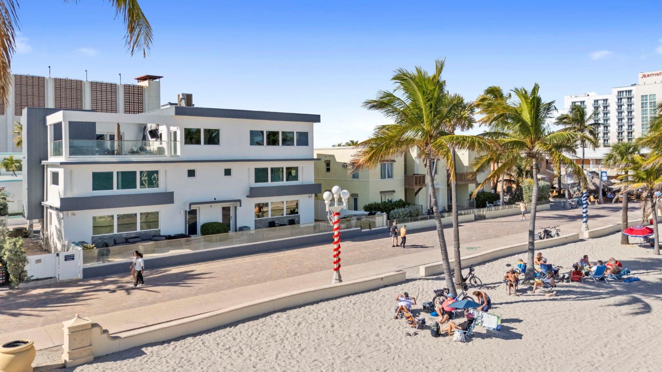Own a truly one of a kind 8200 sq ft oceanfront residence located directly on the Beach and Broadwalk. This exceptional 10 bedroom, 6 bath property offers unmatched versatility. Designed for flexibility, the home can be enjoyed as one expansive private residence or configured into three separate units making it ideal for multi-generational living, rental income or mixed-use potential. A fantastic rooftop terrace provides panoramic views overlooking the ocean and you will find the same stunning views from just about everywhere in the house. Bedrooms are all truly nice size and there are 2 primary. Property is fully fenced in with ample parking and an elevator. Whether you are seeking a beachfront home or a high potential investment this rare offering delivers space and location.