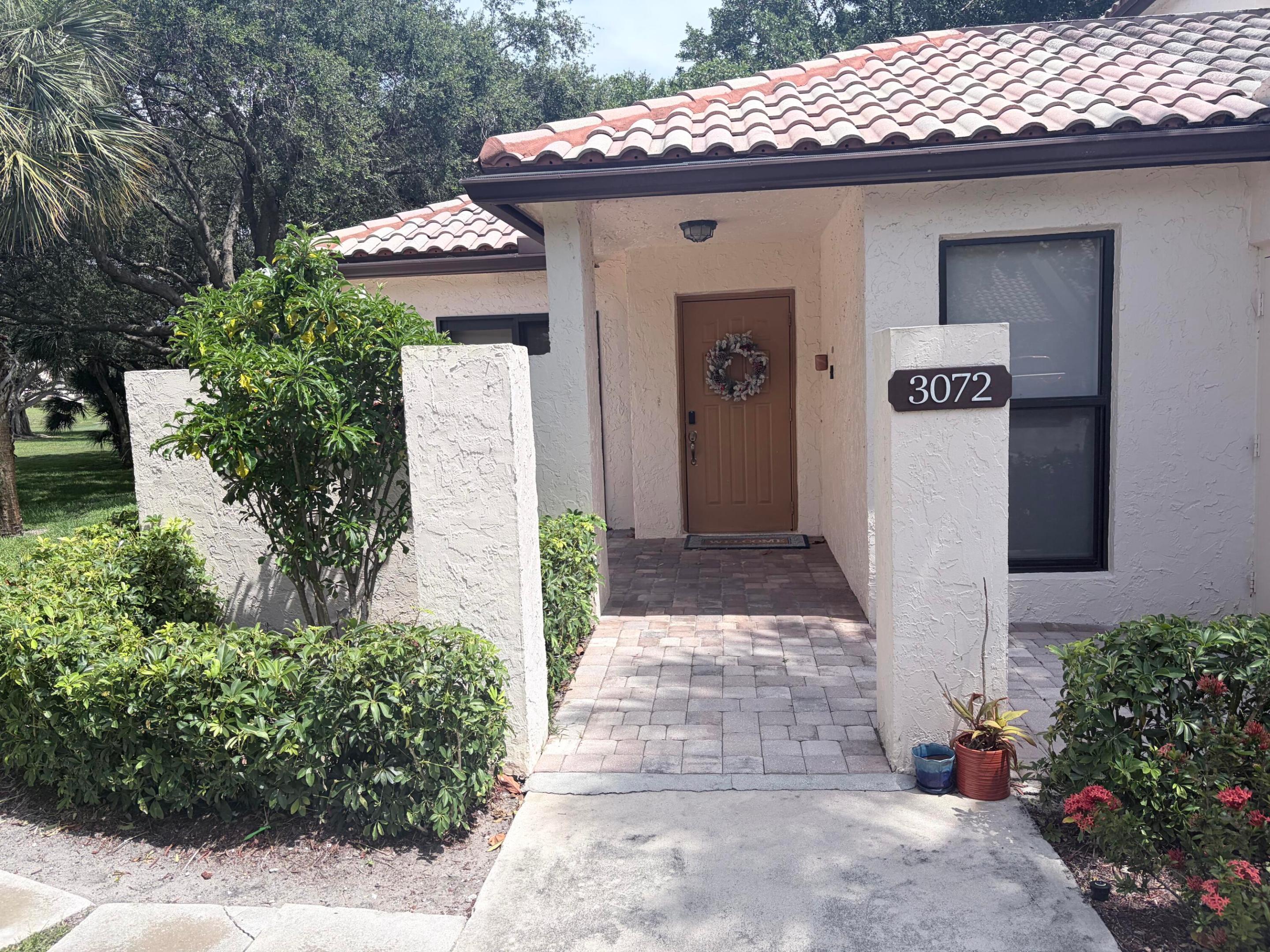 Gorgeous East Boca Raton end unit villa in,Gated Community of Lake Windwood Breathtaking Water Views, 5-Acre Wildlife Preserve and Open Green Space! Stunning Fully Remodeled Villa ! Bright Open Floor Plan 2 BR | 2 BA & Screened Patio! Tray Ceilings with shiplap| Luxury Pergo Floors | LED Recessed Lighting | Impact Doors & Windows! Gorgeous Eat-In Kitchen Custom Modern Wood Cabinets| Breakfast Bar | Granite Counters | S/S Appliances. Impressive Primary Bedroom | Walk-In | Ensuite! Washer & Dryer!. Peaceful walking path down the the lake. Upfront parking next to your villa.If you have a fussy client this is the unit for you!