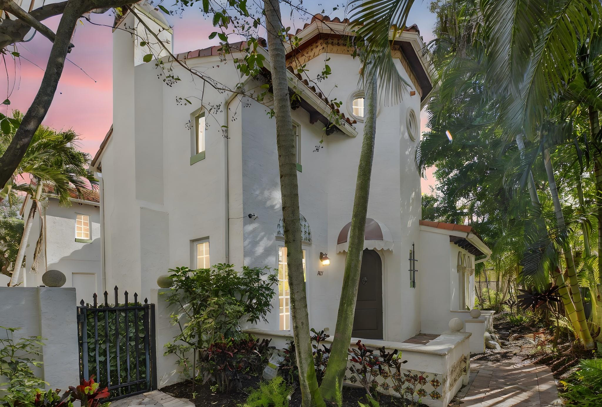 LOCATION! LOCATION! LOCATION! LOOK NO FURTHER. One mile away from the beach and 1 1/2 mile from the buzzing nightlife and gourmet restaurants of downtown Atlantic Avenue.  The open living home has high Cathedral ceilings with 1/2 bath plus den/office/library and partially covered outdoor patio with a 3 car garage.  A beautiful 6 foot chandelier lights up a circular stairway to 3 large bedrooms upstairs with roomy closets and each with a private bath. House is well maintained and newly painted.  Windows and doors are all hurricane impact with plush landscaping maintained by the HOA.  Don't miss out on this beautiful gated community of Old Palm Grove in East Delray with low maintenance fees.
