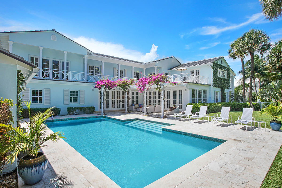 Palm Beach Paradise. This recently renovated classic Palm Beach Island masterpiece will astound you. The sophisticated and open floorplan provides a bright and tranquil setting just steps from your deeded beach access and close to the best of Palm Beach shopping and dining. 
The contemporary design features beamed ceilings and living spaces that flow gracefully unto each other. A major renovation added additional space and modern high tech conveniences such as a brand new elevator, a/c units, a new roof and impact GCI windows and doors. Travertine marble floors lead gracefully throughout the main floor. The heart of the home, the large family room, overlooks the pergola covered patio and the 20’x40’ pool. Adjacent is the kitchen with custom cabinetry, granite countertops and all new appliances. The butler's pantry is the perfect spot to fix a cocktail or to prepare a cup of coffee. Upstairs awaits your own private master suite plus four additional bedrooms. A spacious second floor sun terrace and covered patio beckon you to relax and enjoy your private oasis. 
The two car garage, with entry from a private lane, features a staff bedroom with en-suite bath and a laundry room. 
Come, sit under the bougainvillea covered pergola surrounded by well-manicured hedges and enjoy the ultimate in Palm Beach privacy and seclusion.