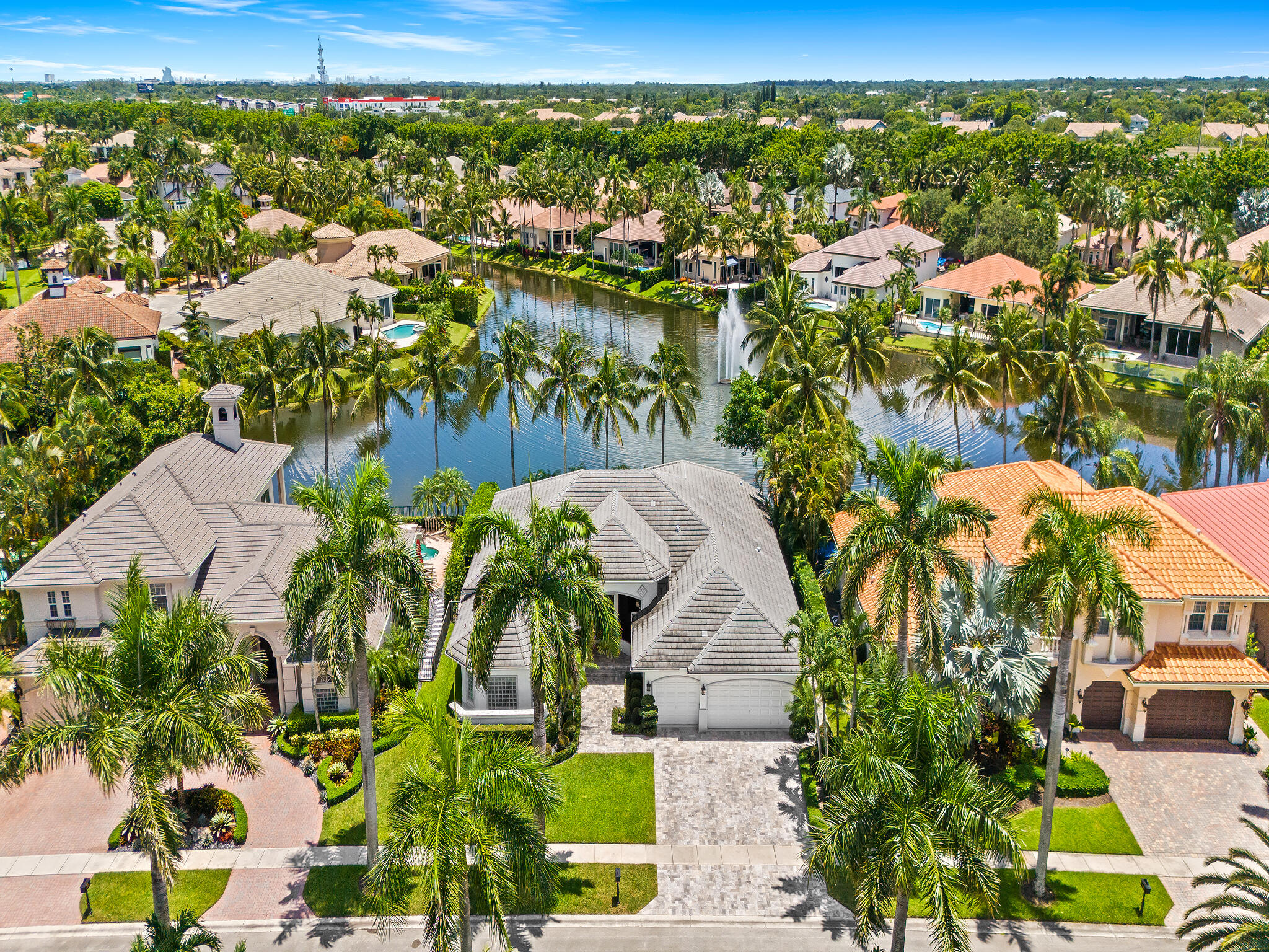 Nestled on a quiet cul-de-sac street, this beautifully maintained home captures expansive lake views with a stunning fountain backdrop. Offering a true 5-bedroom floor plan, the home features a fully renovated kitchen, a fully renovated pool, a 2017 roof, upgraded front pavers with lush tropical landscaping, a fenced backyard, and a new washer and dryer. An exceptional waterfront setting that offers both privacy and beautiful outdoor living.