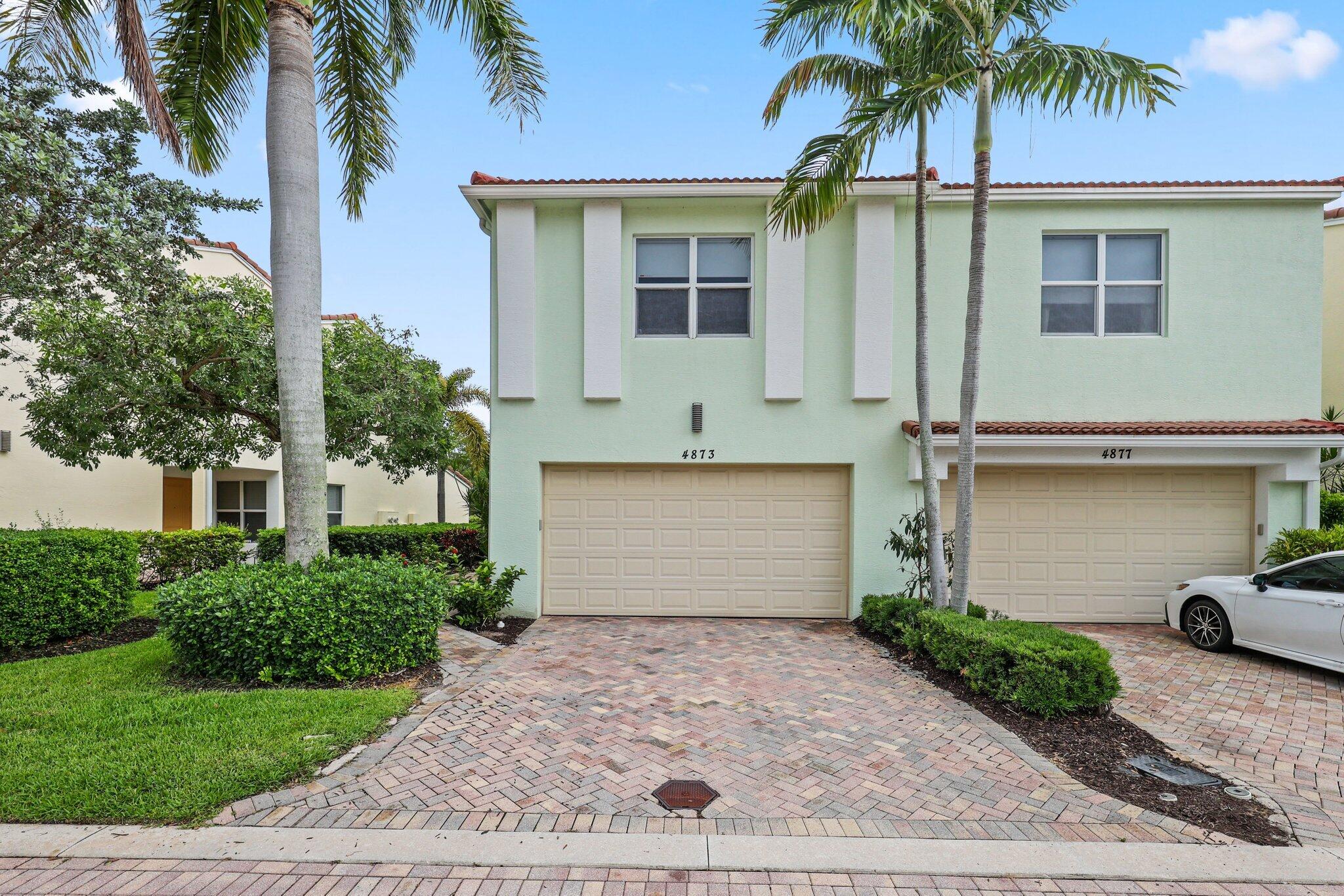 Rarely available Guava model offering 3 spacious bedrooms and 3.1 bathrooms, perfectly positioned on a private preserve lot. Impeccably maintained, this residence showcases custom cabinetry with soft-close drawers, a wraparound kitchen island, stainless steel appliances, crown molding throughout, a custom wood-and-metal staircase, motorized blinds, custom closet built-ins, and updated flooring and carpeting throughout. Enjoy a private backyard retreat backing directly to the preserve, providing peaceful views and privacy. Designed for both comfort and convenience, the home is ideally located within walking distance of restaurants, shopping, offices, and parks, while offering easy access to I-95 and the Tri-Rail station. The HOA fee includes gated entry, common area maintenance, exterior painting, landscaping, basic cable, and access to the community pool and tot lot, creating a low-maintenance lifestyle in one of the area's most desirable locations.