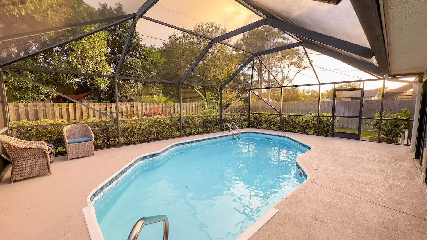 Welcome to the backyard you'll never want to leave. Tucked behind lush tropical landscaping, this move-in ready 3-bed 2-bath home offers the kind of outdoor living that's hard to find. Spend your weekends in the saltwater pool, unwind in the hot tub, entertain under the screened lanai, or simply enjoy the privacy of your fully fenced backyard. Inside, the split-bedroom floor plan is highlighted by an oversized primary suite w/a beautifully updated ensuite. The home is completely move-in ready, can be purchased fully furnished/turnkey & has a brand NEW ROOF.  With no HOA & a location just minutes from the beach, you'll have the freedom to enjoy your home your way. Whether you're looking for your first home a vacation vacation getaway, or an investment, this property checks every box.  It has been operating as a successful Airbnb, and financials are available upon request.  Some homes check the boxes. This one changes the way you spend your weekends.
