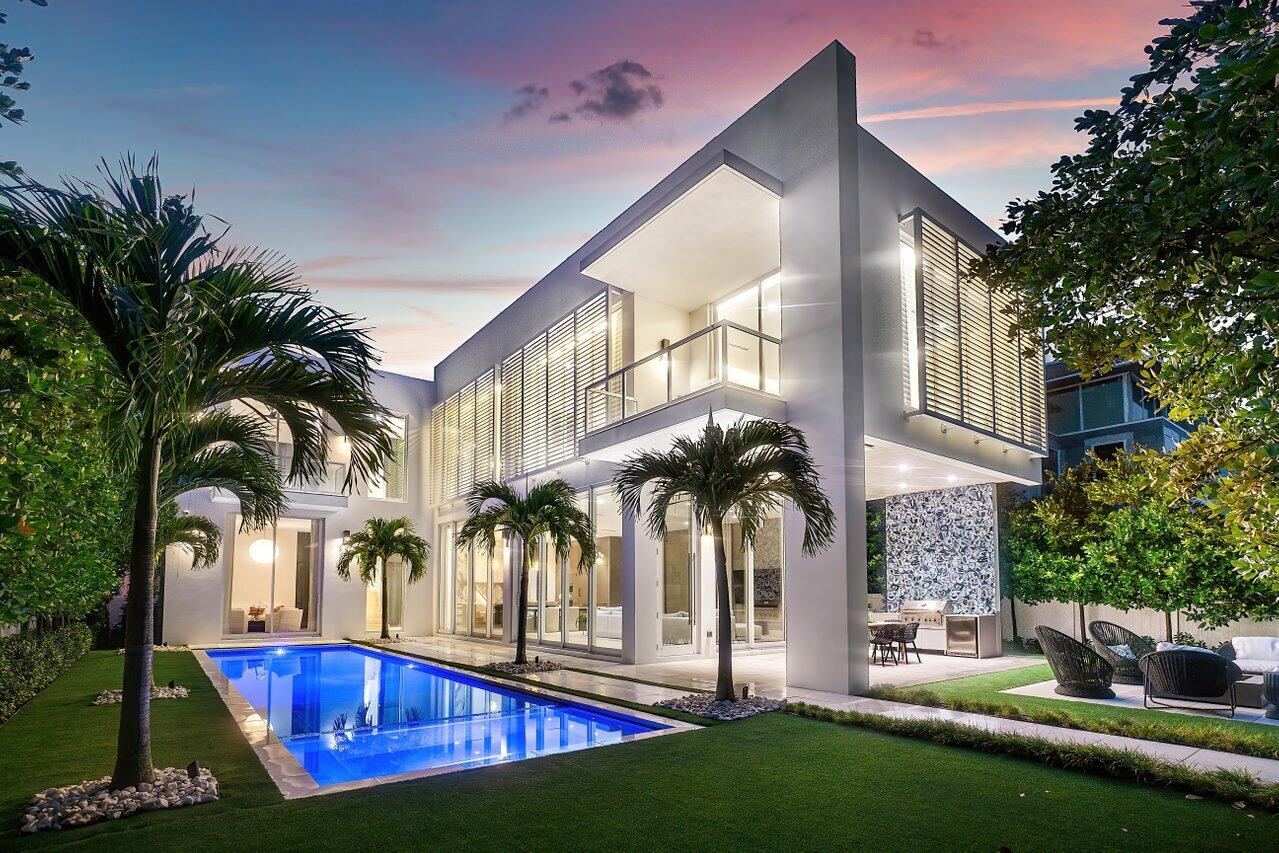 Have you ever wondered what it would be like to have a private resort in the heart of one of South Florida's most esteemed neighborhoods? At 132 NE 7th Avenue in Delray Beach's Palm Trail, tropical fantasy becomes coastal reality. Comprising 6,235 total square feet, 4,778 of which are under air, this vast 2022 construction has 4 bedrooms and 4.1 bathrooms along with a home office, media room, gym/flex area, and so much more to offer the highest level of luxury in a superb location. 

This organic-modern style home features a private courtyard gated entrance along with a massive 4-car garage that leads directly into a mudroom and powder room. From there, the home expands into its open kitchen and great room, which feature airy 12-foot ceilings and panoramic sliding glass doors that overlook the backyard and pool. The stunning kitchen includes organic modern custom cabinetry, Caesarstone/quartz countertops with concrete textured finish throughout, a walk-in pantry and appliance garage, island with designer pendant lighting and Sub-Zero wine refrigerator, Wolf gas cooktop and dual ovens, and a Sub-Zero bottom freezer refrigerator. The island overlooks the cavernous great room, which opens directly to the backyard. 

The home's dazzling outdoor spaces are enclosed by privacy walls and verdant landscaping with 12-16' trees to ensure tranquil seclusion for pool days, backyard lounging, or entertaining. Outdoor amenities include a 43' resort-style saltwater pool with sunshelf, spa, pebble finish deck jets, and fountains; covered outdoor loggia, natural gas fire pit with seating, and summer kitchen with porcelain bookmark wall feature, beverage center and natural gas grill. No matter the season or the occasion, this backyard offers everything a host could ever need to entertain for the perfect outdoor gathering.

Back inside and across from the kitchen is the home's office/Bedroom 4 suite currently being used as an intimate sitting area, which includes an ensuite bathroom and walk-in closet, as well as the staircase and elevator for access to the second floor. Upstairs, the second floor is illuminated by ceiling-height windows and abundant skylights, and houses the home's main living spaces, which include the primary suite along with two additional bedroom suites, each of which includes its own walk-in closet and ensuite bathroom. The spacious primary suite begins with a private hallway lined with floor-to-ceiling glass overlooking the pool, which features a morning bar with Caesarstone countertops, designer tile, undercounter beverage center and open shelving, and leads to the bedroom and bathroom areas. The primary bedroom has ceiling-height glass sliders that open to a private balcony overlooking the pool, while the primary bathroom includes dual floating vanities, a freestanding soaking tub, separate shower with dual shower heads, private water closet, and designer tile and pendants throughout. Custom dual built-in closets and a separate linen closet round out the suite and provide ample storage. 

The second level also houses a dedicated media room and lounge, which includes a wet bar with undercounter beverage center, sink, and floating shelves, along with a unique and convenient flex space, which is currently separated by a glass divider to act as both a secondary home office and exercise area and has its own balcony overlooking the backyard. 

Tactful interior design features throughout the home include 9-inch wire-brushed white oak wood flooring throughout, dramatic bespoke floor-to-ceiling custom drapes, and designer lighting fixtures and wallpaper. Additional amenities include a massive 4-car garage, elevator, impact glass windows, doors and sliders, 3 AC zones, motorized shades downstairs, a hardwired security system with exterior cameras, and a fully-equipped AV system that includes a Samsung 85" TV, Sonos whole-home indoor and outdoor sound system, and wireless access points both indoors and outdoors. 

At this immaculate Palm Trail residence, the best of contemporary in-home convenience blends with the charisma of South Florida's Village by the Sea to offer the epitome of luxury coastal lifestyle. Nothing has been left to the imagination at 132 NE 7th Avenue  it's all right in front of you. 

The information published and provided including but not limited to prices, measurements, square footages, lot sizes, features, finishes, and calculations are subject to errors, omissions or changes without notice.  All such information should be independently verified.  All parties should perform their own due diligence to verify all information.