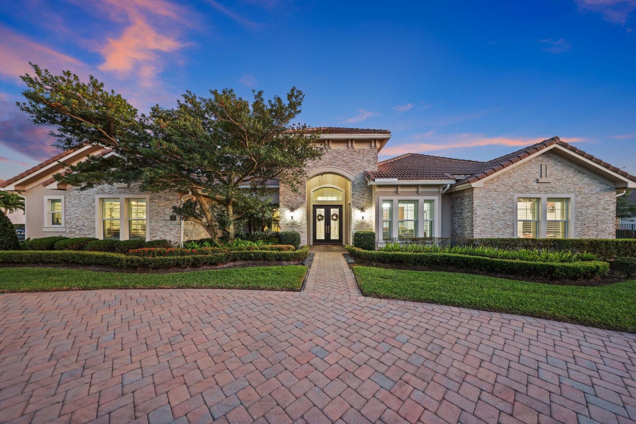 Masterfully reimagined & crafted for luxurious living, this 4-bed | 4-bath estate in the prestigious gated enclave of Sterling Ranch embodies modern elegance at every turn. Nestled on a sprawling homesite, this custom residence showcases soaring ceilings, expansive open-concept living, and curated finishes. The gourmet kitchen boasts a grand quartz island, premium self-cooking Sub-Zero & Monogram appliances, double ovens, and an oversized walk-in pantry. Retreat to a spa-like primary suite with dual walk-in closets, a freestanding soaking tub, & his-and-her shower. Impact windows & doors, plus a 3-car garage, complete the package. Enjoy a solar-heated Salt water pool & lush yard with mango, lemon, and cherry trees. Minutes from top-rated schools, shopping, dining, and the Hard Rock Hotel.