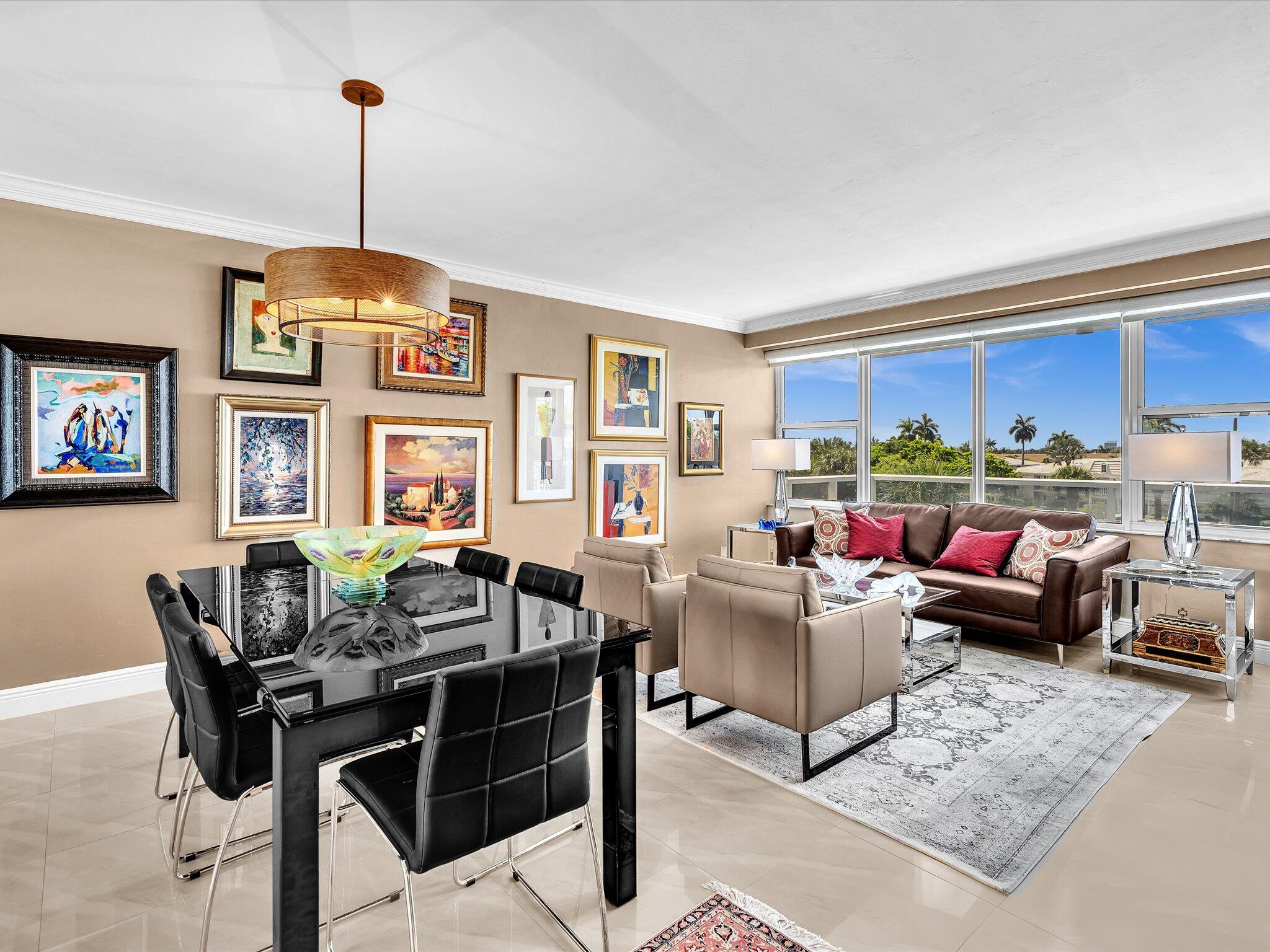Enjoy this beautiful move-in ready residence filled with designer touches. Featuring a brand new kitchen, glamorous interior doors and high end closet cabinetry. The primary suite boasts sitting area, walk-in closet and ensuite bath with frameless sliding door shower. Apartment comes fully furnished with intentionally selected artwork and furniture pieces.  Fully funding reserves, 55+ community, 24/7 security, fitness center, pool, IntraCoastal clubhouse and much more.