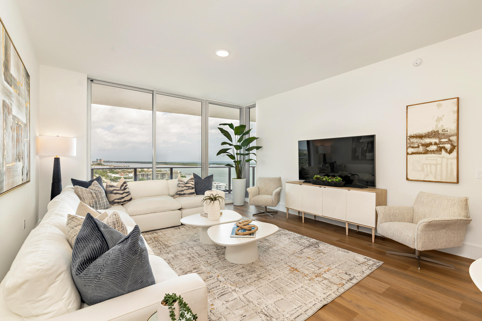 One of the best values in the building, don't miss out! From the moment you step inside, the 10' ceilings and floor-to-ceiling impact windows and doors make this light-filled unit stand out.   The finishes throughout the unit are what you would expect. Porcelain tile flooring, polished chrome fixtures and plumbing hardware, and spacious walk-in closets that are rare to find in condos of this size.   The unit is also Smart Home Ready with ultra-high-speed connectivity, so home automation is completely customizable. A UVC Air Disinfection System by Blue Halo is also included for those who appreciate cleaner air. The kitchen features Miele appliances, quartz counters with a waterfall edge, European cabinetry, and a wine cooler. Bathrooms are equally well done, with full-height tile showers, a