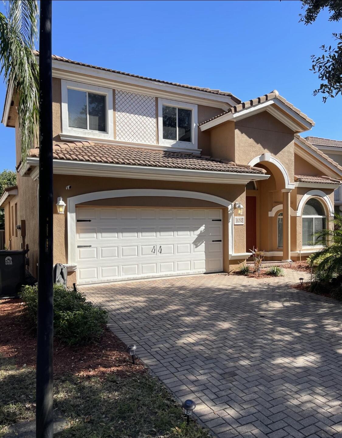 Buyer gets $5,000 to assist with closing cost!!! Welcome to the highly sought-after Terracina community in West Palm Beach! This beautiful home offers two master suites, on each floor. The first-floor master retreat features three spacious closets and a relaxing garden tub. Terracina is a vibrant neighborhood with two gated entries, a resort-style pool with splash center, fitness center, basketball court, and over three miles of scenic walking paths.This home is thoughtfully equipped with a security system, cameras, motion-sensor lights, and two-way communication cameras for added peace of mind. Plus, enjoy the privacy of having no rear neighbors.