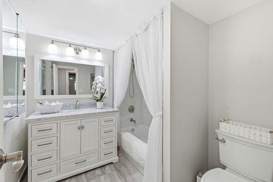 Welcome to this beautifully remodeled 2/2 Man-gated community. This spotless condo boasts elegance and upgrades throughout! Step into this space to discover real cherry wood cabinets in the kitchen with granite counters and backsplash. Pantry conveniently has pull out drawers. Upgraded wood baseboards throughout along with high-end ceramic tile floors.  A/C has halo light and Nest Thermostat. Elegant and inviting living area. The spacious primary bedroom has a large, organized walk-in closet. Updated bathroom has lots of vanity space and remodeled shower. Second bedroom has a large closet.  Second bath is also updated.  Enjoy your morning coffee on your inviting patio. Impact glass throughout! Maintenance offers upgraded cable, water, Internet, Rec facilities, and much more!!