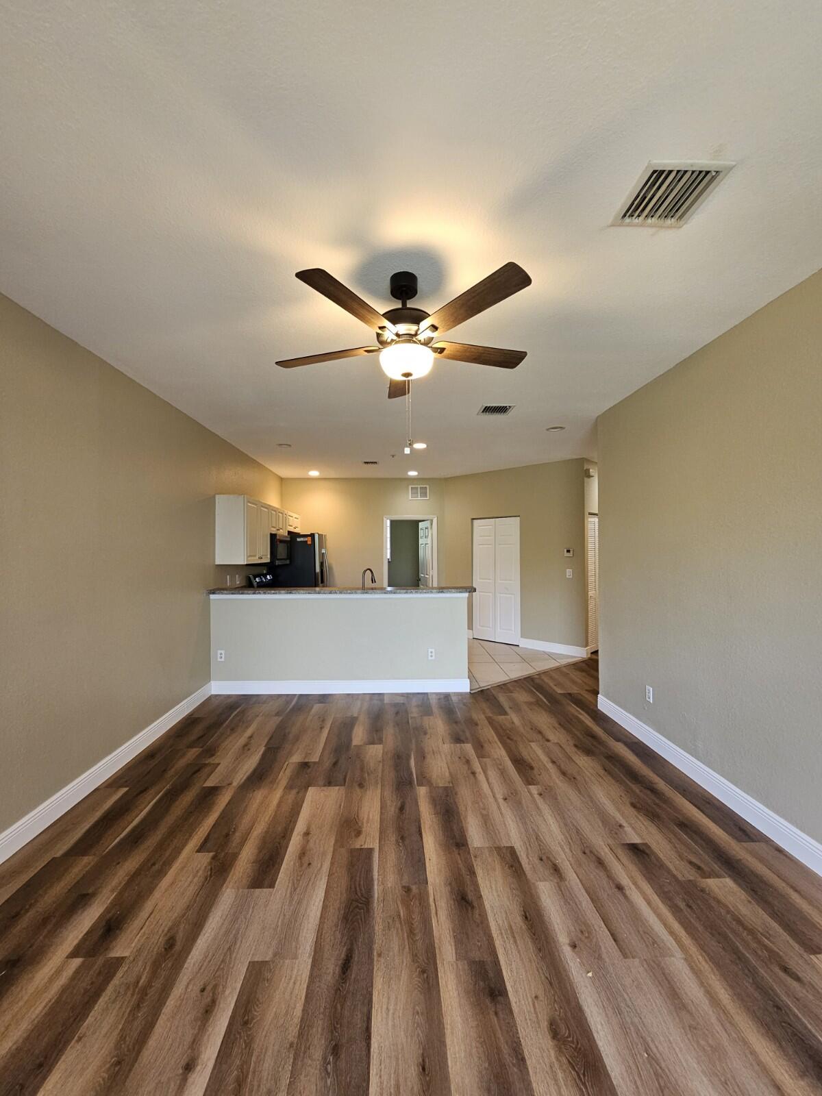 Beautifully renovated and freshly painted 3-bedroom, 2-bath second-floor condo in a gated community! This move-in ready unit features brand-new stainless steel kitchen appliances, updated kitchen and bathrooms, and brand-new laminate flooring throughout the main living areas and bedrooms.The spacious primary suite includes a walk-in closet and a private en-suite bath. Located in a well-maintained, amenity-rich community with scenic lakes, fountains, a pool, tennis courts, clubhouse, and fitness center.Centrally located in Riviera Beach with easy access to major highways, schools, shopping, and dining. Excellent rental opportunity in a prime location—schedule your showing today!
