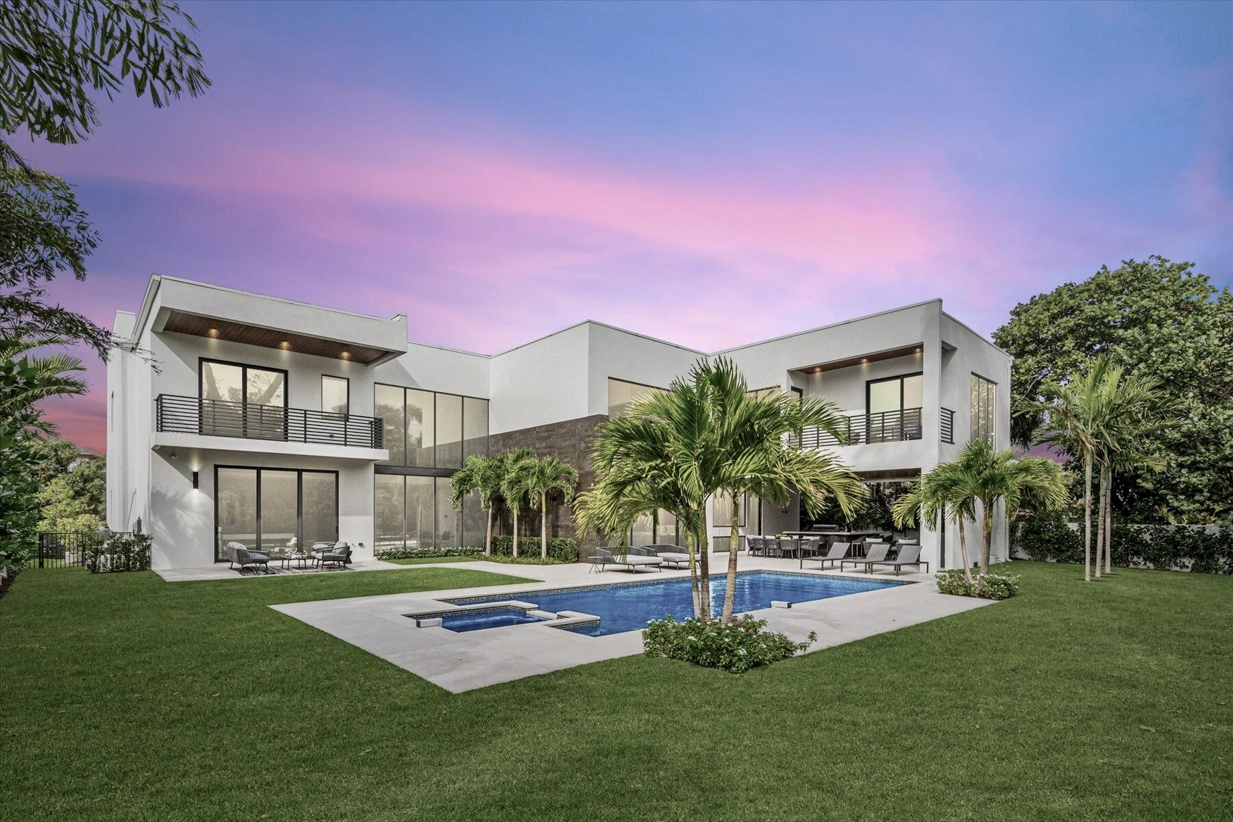 Welcome to a haven of luxury living, where every detail has been meticulously crafted to create a residence of unparalleled elegance. Situated on an oversized 15,000 sq ft lot, this magnificent home boasts a total of 9699 sq ft, with 6,557 sq ft under air. As you step through the 24 ft entryway, the grandeur of the home unfolds with a glass stairway railing that adds a touch of contemporary sophistication. The impact windows and doors throughout not only enhance the aesthetic appeal but also provide a sense of security and tranquility. This residence features 5 bedrooms and 5 full baths, along with 2 half baths, including an outside cabana bath for added convenience. The custom-designed kitchen is a culinary masterpiece, showcasing Quartz counters and top-of-the-line Thermador appliances, with 2 dishwashers, a Pro Grand 6 burner gas range with griddle and double over, a side-by-side 60" refrigerator with a linear wine cooler. This kitchen is a chef's dream. The built in coffee maker adds a touch of luxury to your morning routine. Entertainment is taken to new heights with a walk in wine cooler equipped with a separate AC, a billiard room, and an upper floor loft area. Two large full-sized laundry rooms add practicality to the luxurious lifestyle. step outside to the covered patio with a gas fireplace, and outdoor kitchen with a built in grill, and a large pool (35 x 16) with a gas heated spa. Perfect for entertaining or simply enjoying the Florida sunshine, this outdoor space is a true retreat. Additional features include a whole house generator, a 3-car garage with an epoxy floor guard hyper bond with Broadcast chips, 2 tankless gas water heaters, a 4-zone A/C system, and a Smart House-Security Control 4 system with remote control options. This home seamlessly combines unparalleled comfort and sophistication.