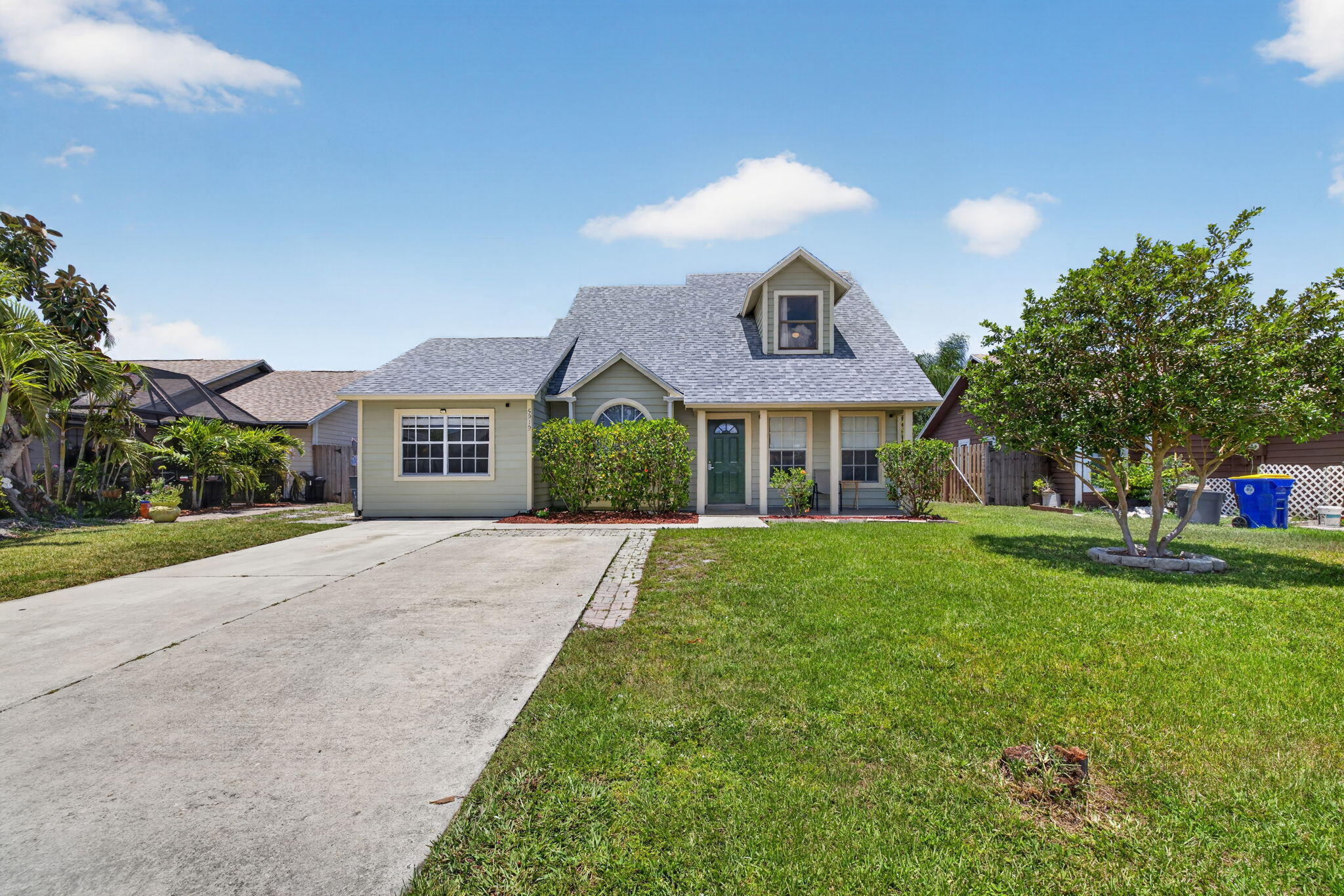 Welcome to 5919 SE Pine Drive, a well-maintained 3-bedroom, 2-bath home with a versatile bonus room located in the garage, offering flexible space for a home office, gym, playroom, or hobby area. Situated on a quiet dead-end street in a kid-friendly neighborhood in Stuart, this home combines comfort, functionality, and a desirable location.  Built with durable concrete block construction, the home offers lasting quality and peace of mind. Inside, you'll find tile flooring throughout the downstairs living areas, creating a clean and low-maintenance layout ideal for everyday living. Upstairs is finished with comfortable carpeting. The kitchen comes complete with all appliances needed for convenient move-in readiness, making this home truly turnkey. Additional updates include a shingle roof installed in 2021, a newer water heater (2026), and an AC system approximately 6 years old, providing added confidence in major systems. A new irrigation system supports a well-maintained exterior, and partial hurricane-impact windows offer enhanced protection and efficiency.  Outdoor living is easy with a screened-in patio, perfect for relaxing, entertaining, or enjoying Florida's year-round sunshine in comfort.  Located in a welcoming, family-friendly community, this home is zoned for highly regarded local schools and is conveniently close to parks, playgrounds, and recreational activities. Nearby, residents can enjoy boating, fishing, and waterfront dining along the St. Lucie River and Intracoastal Waterway, as well as beaches just a short drive away. Additional nearby attractions include shopping centers, golf courses, nature preserves, and downtown Stuart's vibrant dining and entertainment scene.  This move-in-ready home offers a great combination of updates, location, and lifestyle—schedule your private showing today and experience all that Stuart living has to offer!