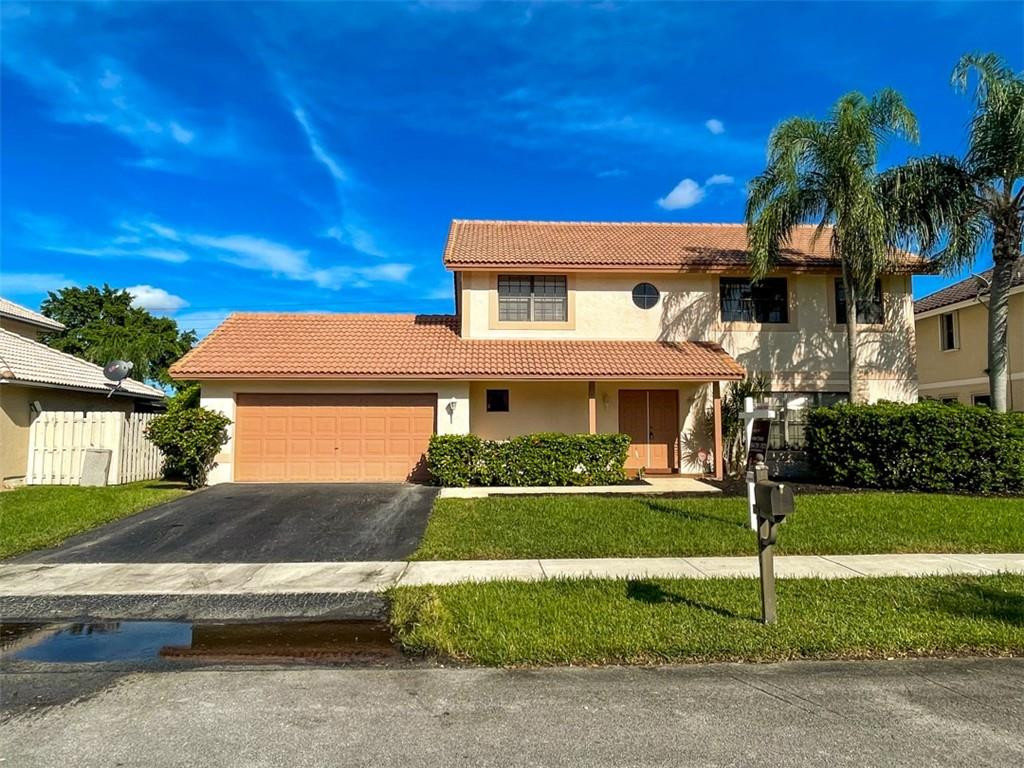 (Photos are copyrighted & the right of the Listing Agent & Seller only). Shenandoah provides a welcoming drive into its community with mature and manicured landscaping, and an ideal location for commuting on I-595, I-75, and close proximity to amenities. First time on the market, original owner, 4 bedroom, 2.5 bath, (2) separate large living spaces, dedicated dining room, approximately 2007 barrel tile roof, and 2021 AC unit. This home provides an immediate green grass view of the backyard upon walking in the door, perfect to build a pool view, very low HOA, oversized master bedroom, large ensuite bathroom with separate shower and tub, and a 7620 square foot lot.  Shenandoah is known for better schools, their parks, walking trails, and neighborhood events.
