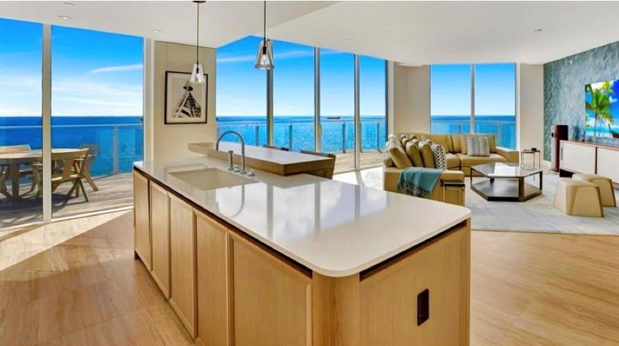 DIRECT OCEANFRONT SOUTHEAST CORNER WRAP-AROUND BALCONY FOUR SEASONS PRIVATE RESIDENCES, 4 bedroom, 4 1/2 bath and a southeastern exposure with direct ocean views . Dramatic floor to ceiling glass and gracious open wrap around terrace affords you ample natural light throughout the home. Gourmet kitchen with custom lacquered cabinetry, Sub Zero and Wolf appliances. Abundant illuminated closet space throughout this luxury residence. Baths are adorned with signature marble, custom oak cabinetry, and brushed nickel Waterworks fittings. Seamless/capless glass rails maximize your unobstructed views of the ocean. Assigned parking, either self park or valet as an exclusive VIP amenity offered to all owners.