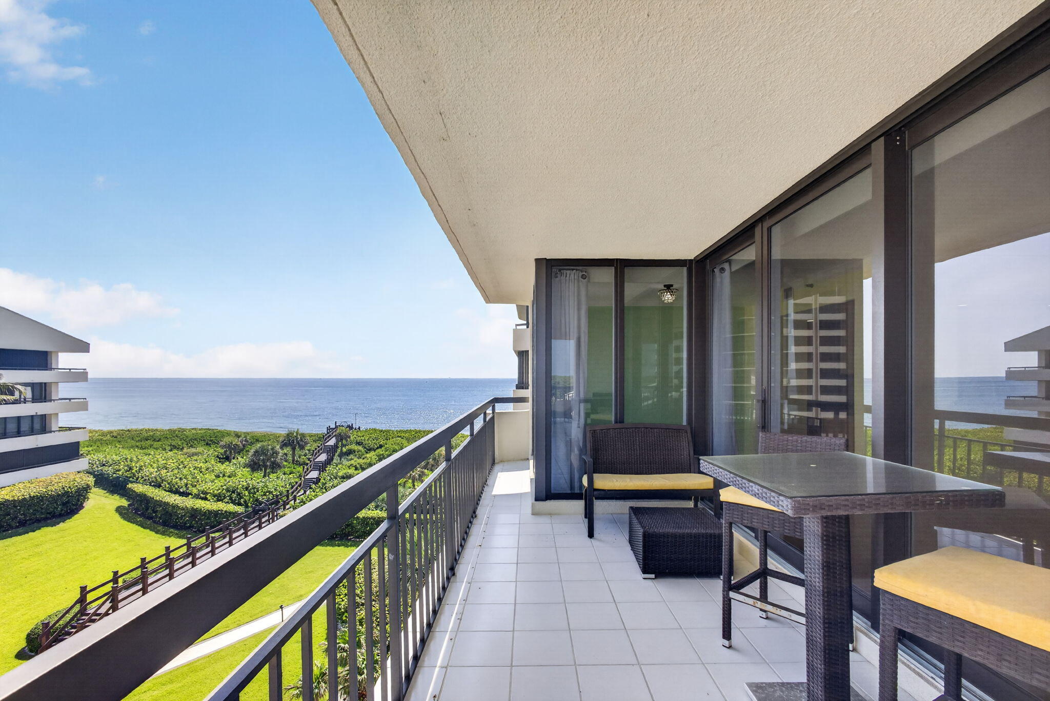 Enjoy sweeping ocean views from every room in this expansive corner 2-bedroom, 3.5-bath residence offering 2,011 square feet of refined coastal living. Designed with an open floor plan, the primary suite features dual bathrooms and large walk-in closets. A spacious indoor laundry room includes a new washer. Impact glass throughout, new HVAC, and updated water heater provide peace of mind. Overlooking a renovated resort-style pool deck, residents enjoy a private beach club with 365-day attended service on one of Singer Island's widest beaches. Amenities include a culinary restaurant with in-unit dining, pools, spa, fitness centers, tennis, pickleball, owners' lounge, billiards, library, concierge, manned gate, garage parking, all near a state park preserve, golf, shopping and dining.