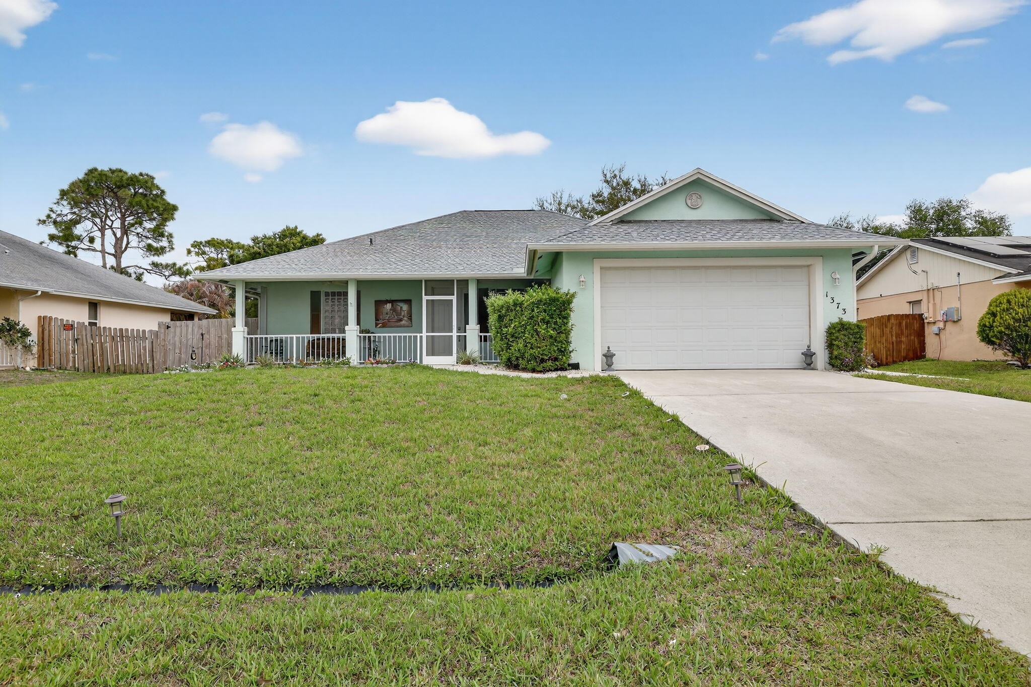 Beautiful CBS Home with 3 bedrooms and 2 bathrooms, along with a spacious garage with exterior access.  This move-in-ready property offers a New Roof (2025)  2 years old Water Heater, 2 years old A/C and a large backyard with a fully fenced wooden fence perfect for relaxing or entertaining. Conveniently located near major highways such as I-95 and the Turnpike, and just minutes from Tradition,  where you'll find excellent restaurants and family-friendly entertainment.  Don't miss the opportunity to make this house yours!