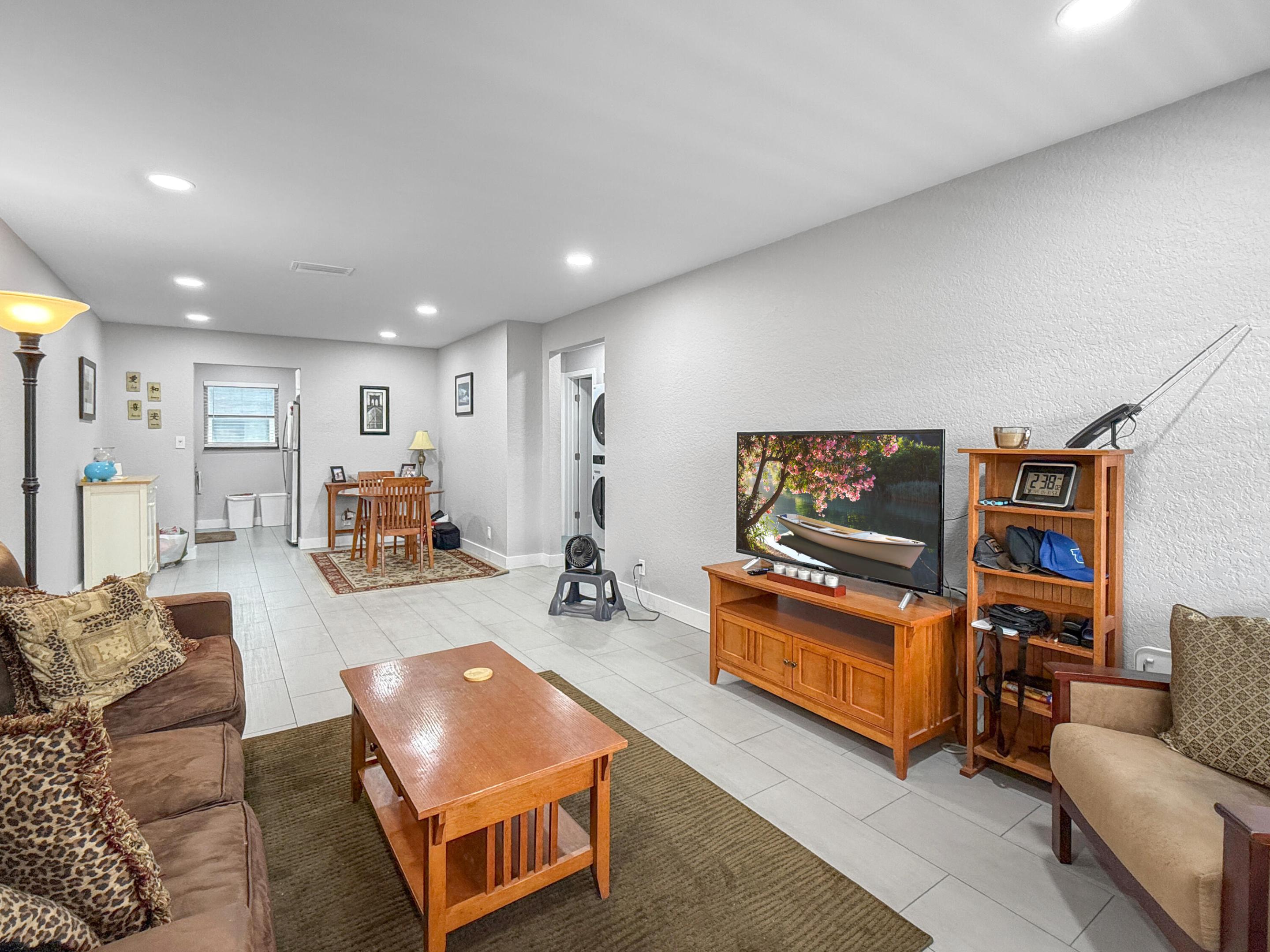 The PERFECT Wilton Manors pied-à-terre: a 2nd floor updated condo with in unit laundry! Only 1.5 blocks to Wilton Drive! This 2 Bed, 1 Bath unit is light & bright and was fully updated in 2022. The galley kitchen features glossy white cabinetry & stainless steel appliances. This home also has generous sized bedrooms and a bathroom with walk-in shower. Plus this unit comes with 2 assigned side by side parking spaces! Additional guest spaces nearby. Investor-friendly complex (yes, can rent immediately, for minimum 3 months - "transient rentals" not allowed). The monthly condo fee is $618.15 & covers: property manager, community pool, common area maintenance, insurance, water/trash/sewer, & reserves. Central AC replaced in 2022. Call today! (all info believed accurate but not warranted).