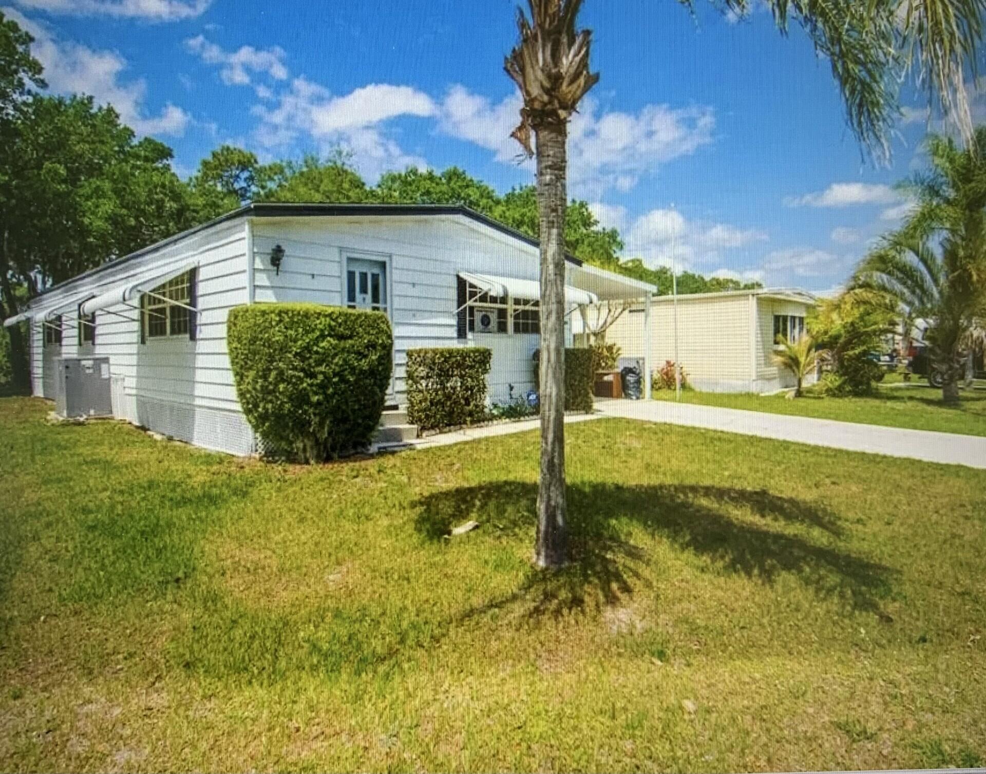 Retirement living at its best! This move-in ready 3-bedroom, 2-bath home features laminate flooring throughout and is fully furnished. The A/C and water heater are in excellent condition and regularly serviced. The shingle roof, 18 years old, is in great shape, and all ductwork was replaced in 2025. Owned by a master craftsman, the home was maintained meticulously and includes thoughtful features like an emergency power outlet. Located on the St. Lucie River in a 55+ community, this property is ready for you to make it your new home.
