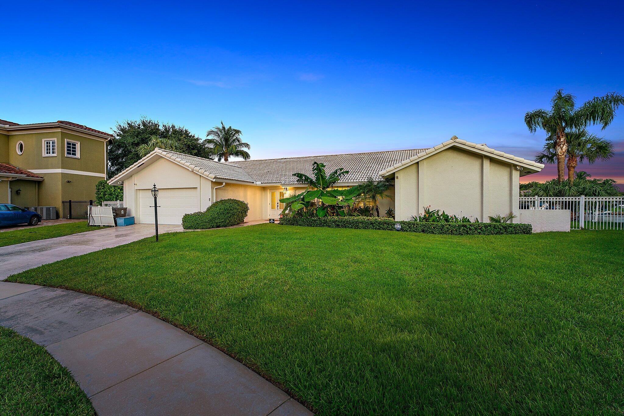 Opportunities like this don't come around very often! Nestled on a serene cul-de-sac, this stunning waterfront property boasts an impressive 205 feet of deepwater frontage. Ideal for yacht and sportfish owners, you can easily park your boat right behind your home and still have space for a tender. Recently remodeled within the last two years, this home features a contemporary design with upgrades throughout, including a gourmet kitchen, luxurious bathrooms, new flooring, and durable impact doors and windows. With additional square footage, you'll enjoy a generous layout that encompasses 5 spacious bedrooms and 4.5 baths, boasting an oversized primary bedroom that serves as your private retreat. Step into your own backyard oasis, complete with a  gorgeous pool and spa as well as an expansive deck that offers breathtaking views of the waterperfect for entertaining or simply relaxing in the sun. Located in the heart of Palm Beach Gardens, you'll have easy access to fine dining, shopping, and major highways, with the inlet and ocean just minutes away. Don't miss your chance to own this exceptional property. schedule a viewing today!