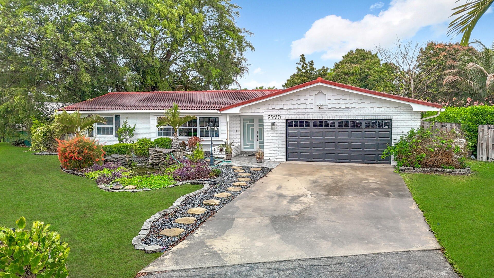 Welcome to this beautifully remodeled home on a quiet cul-de-sac in desirable Coral Springs. Blending luxury, comfort, and everyday functionality, this move-in-ready home features an oversized custom kitchen with double sinks, double ovens, double cooktops, double microwaves, extensive cabinetry, and expansive counter space ideal for entertaining, meal prep, and gathering with family and friends. Renovated bathrooms, replaced plumbing, and quality updates throughout add style and peace of mind. Step outside to an oversized private and fully fenced backyard with peaceful canal views and plenty of room for a pool, play area, or outdoor entertaining space. Conveniently located near major roads, shopping, dining, and everyday essentials, this home offers both privacy and accessibility.