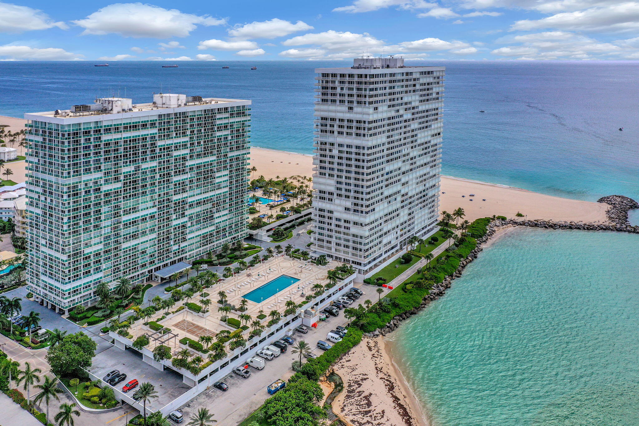The comfort of a home, the ease of a fully managed building, all just steps from Fort Lauderdale's best stretch of beach. Rarely available at Point of Americas, this expansive 4BR/4BA + two living spaces + office space, residence offers over 3,000 SF with a split floor plan, 10' ceilings in the main areas, and an updated kitchen with storage. One room is currently configured as an incredible dressing room but it can easily be converted back. Unlike a traditional high-rise residence, this 1st-floor (locd. on 2nd) home is designed for those who value convenience and privacy. Park just steps from your door and come and go without long elevator rides or crowded hallways, while still enjoying the security, service and amenities of one of Fort Lauderdale's premier beachfront communities.  Set within Point of Americas' private 10-acre gated enclave, residents enjoy a private attended beach, two pools, multiple fitness centers, guest suites, library, restaurant, 24-hour security and concierge, and beautifully maintained grounds. The attentive staff and on-site team create a true lock-and-leave lifestyle that feels more like a luxury resort than a condominium. Perfect for buyers who need the space of a single-family home but want to leave behind the maintenance, insurance concerns and upkeep that come with one. Ideal for families, seasonal residents, multi-generational living, or anyone simply looking for room to spread out in an unbeatable beachside location. One of the largest floor plans in the building and one of the lowest-priced 4-bedroom residences east of A1A, a truly rare opportunity to enjoy the comfort of home with the simplicity of condominium living. The ideal location near Fort Lauderdale's best waterfront dining, Las Olas Blvd, Port Everglades, and just 15 minutes from FLL Airport. 50 year certification complete.