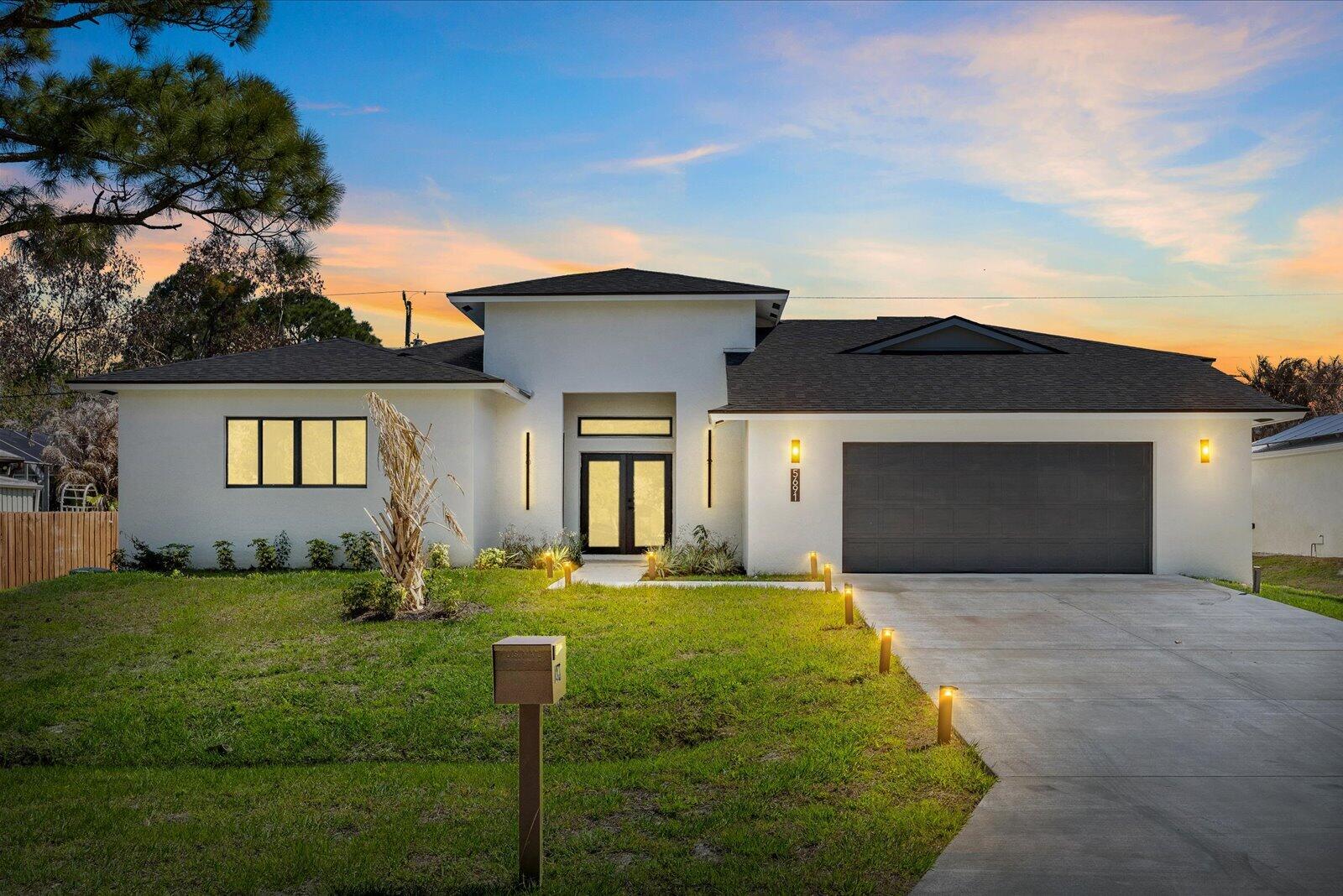 Beautifully designed CBS New Construction Home with modern style and striking curb appeal. The open layout is filled with natural light and features impact windows, high ceilings, and a seamless flow ideal for both everyday living and entertaining. The gourmet kitchen includes quartz countertops, stainless steel appliances, modern cabinetry, a large island, pantry, and built in wine cooler. The primary suite offers large walk in closets and a spa inspired bathroom with dual vanities, a freestanding soaking tub, frameless glass shower, and a private water closet. Designer lighting and custom finishes enhance the home throughout. Additional highlights include an oversized two car garage with exterior door access and a spacious backyard with room to create your ideal outdoor living space.