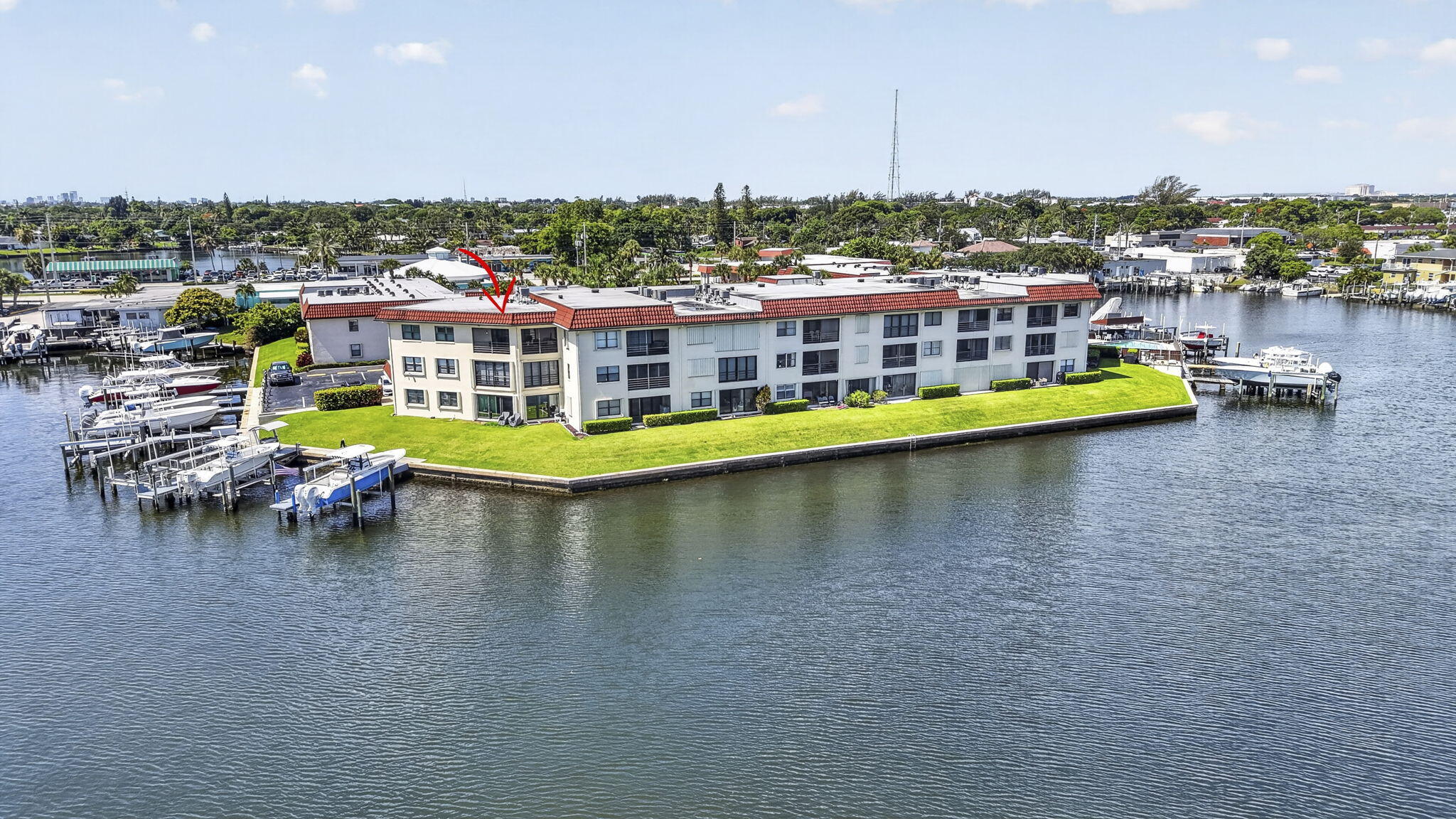 ACCEPTING BACK-UP OFFERS. Take Elevator t0 TOP FLOOR 2BR/2BA CORNER UNIT In Desired Waterfront Community Has INCREDIBLE PANORAMIC VIEWS From All Windows. Walk Into A Bright And Open Living Space Featuring Custom Paint. Knockdown Textured Ceilings. 2025 New Rheem Water Heater,  LG Washer and Dryer.  LG Dishwasher and Stylish Plantation Shutters. IMPACT GLASS Throughout. 4 Ceiling Fans. Lots of Closets. Kitchen Has Granite Countertops, SS Appliances & Pantry. FURNISHED.& Turnkey. Both Baths are completely remodeled.  Enjoy an AMAZING SUNRISE AND SUNSET WITH OCEAN BREEZE ON PRIVATE SCREENED BALCONY. Heated Community Pool. Private Dock. No Boat Slips Available At This Time. Direct Ocean Access Through Intracoastal With 1 Fixed Bridge. Ideal Location Close To Dining, Shopping, Golf & Beaches. A Boater's Dream Area. Quick Ride To Intracoastal, Peanut Island & Palm Beach Inlet. Next To North Palm Beach County Club & Golf Course. Close To I-95, Downtown Clematis, Palm Beach And 20 Minutes To Airport.