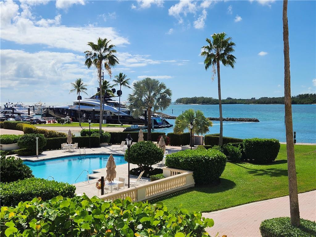 Welcome to Bayside Village on the luxurious community of Fisher Island! Magnificent corner unit with views of Biscayne Bay, Marina and ocean. This fabulous light and airy corner unit enjoys 3 bedrooms, 3/1 BATH, 2,744 Square feet of living area. Perfect for entertaining with multiple expansive terraces. Marble floors, impact glass doors and windows. Large open kitchen and breakfast area. Two garage spaces, one golf cart space and huge a/c storage space. Steps to Beach Club and Marina. Fisher Island amenities include security,  golf course, spa, beauty salon, elementary school, tennis and pickle ball courts, private beach club, marinas, restaurants , and much more.