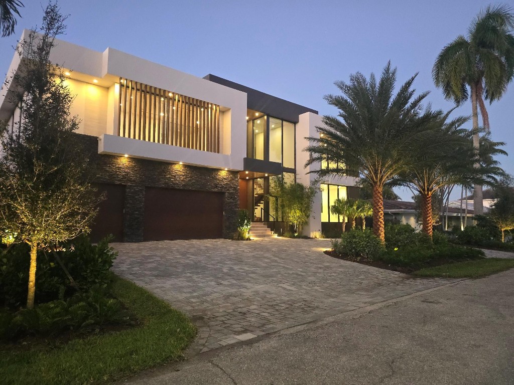 READY TO MOVE-IN! FURNISHED. 2-story deepwater masterpiece in prestigious Coral Ridge blending modern & transitional design with dramatic 22 ft entry ceiling, walnut floating staircase, and open-concept great room. 1st floor features Italkraft chef’s kitchen w/pantry, Sub-Zero & Wolf apps, level 8 waterfall quartz, club room w/full bar, guest suite, wine cellar, commercial elevator & built-ins. 2nd floor offers oversized ultra-lux primary suite w/spa baths & closets, media/game room, 2 ensuite BRs w/shared covered balcony, glass-enclosed gym & dual laundry rooms. Smart home w/Sonos, cams, Wi-Fi, Lutron shades & lighting. Outdoor living includes resort-style heated pool/spa, summer kitchen, 100’ dock w/power & landscape lighting. 3-car A/C finished garage. Top schools nearby.