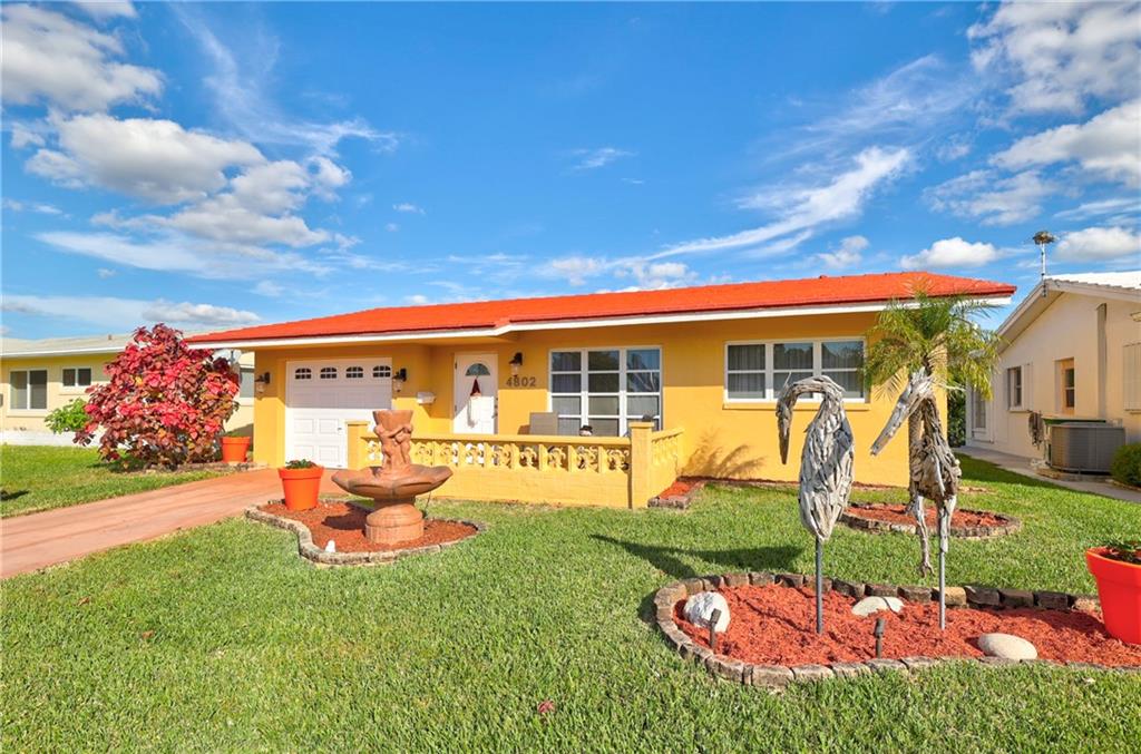 DO NOT MISS OUT ON THIS ONE!! CHARMING EXTREMELY WELL MAINTAINED FULLY UPDATED 2 BEDROOMS, 1 BATH WATER FRONT HOUSE. THIS PROPERTY HAS A LOT TO OFFER!! UPDATED OPEN KITCHEN, WHITE WOOD CABINETS, MODERN STAINLESS TILED BACK SPLASH. NEWER STAINLESS APPLIANCES. BAMBOO FLOORING AND TILE IN THE KITCHEN. WASHER & DRYER IN THE GARARE WITH CABINETS FOR EXTRA STORAGE, ALONG WITH A  MURPHY BED. UPDATED BATHROOM WITH TILED WALK-IN SHOWER. FULLY FURNISHED READY TO MOVE IN. SPACIOUS FLORIDA ROOM OVER LOOKING A RELAXING WATER VIEW.  EXTERIOR PATIO WITH BBQ. WATER ACCES WITH YOUR PRIVATE DOC. ENJOY A RIDE ON THE WATER ON YOUR OWN ELECTRIC POWERED PONTOON BOAT OR PEDAL BOAT. ENJOY THE MAINLANDS OF TAMARAC 55+ COMMUNITY. OFFERS HEATED POOL, CLUBHOUSE & MORE. LOCATED MINUTES TO SHOPPING & RESTAURANTS.