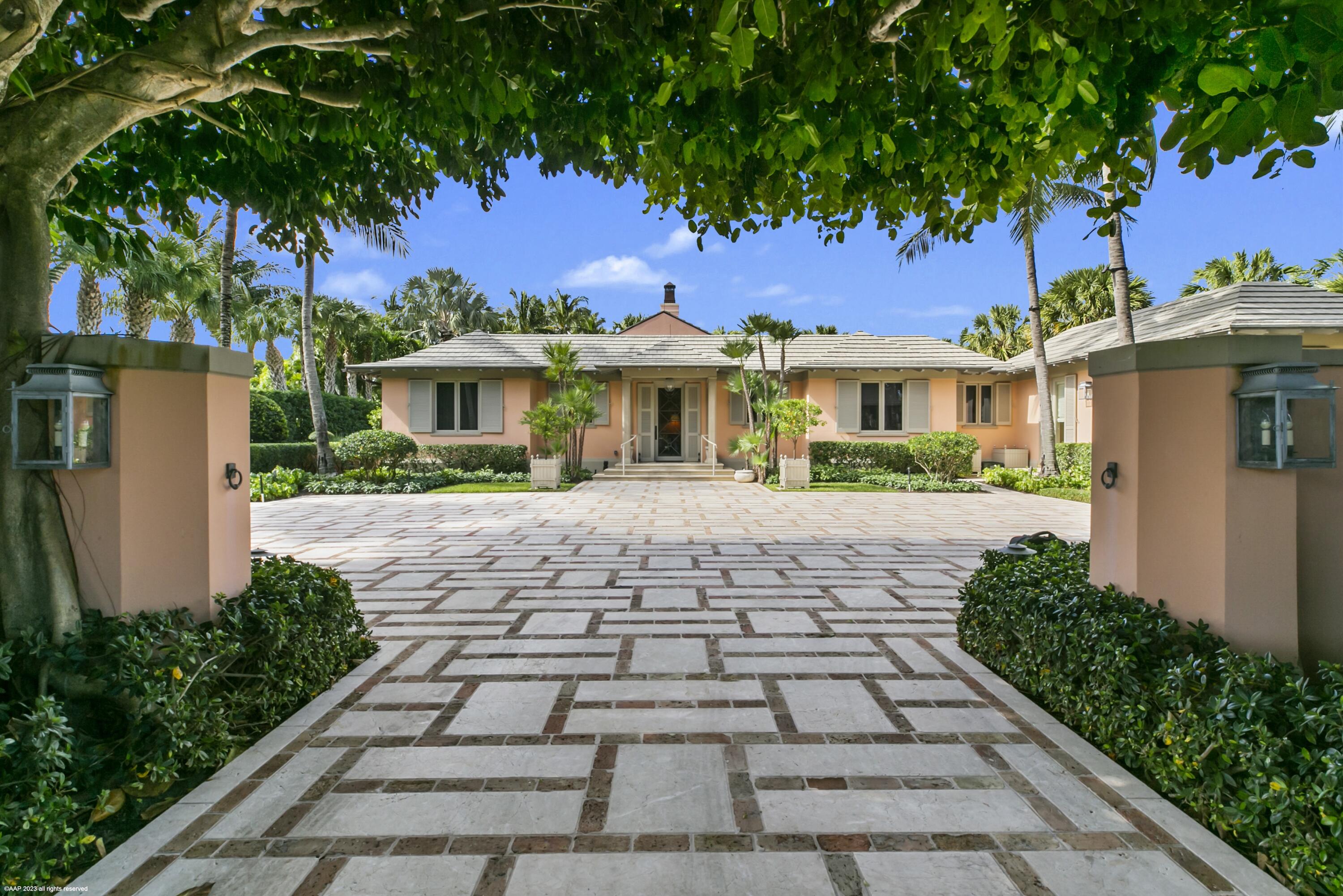 Renovated in 2002, this glorious five bedroom house located in the heart of Jupiter Island offers the best in gracious and elegant living. Expansive entertaining spaces both inside and out allow for large parties or multi generational living during holidays and vacations. 
Each design element has been carefully considered from the heated towel bars and Guerin/Waterworks in each of the bathrooms to the Venetian plaster, trompe l'oeil and cypress walls throughout. The meticulously maintained, verdant gardens with Versailles planters surrounding the pool and fountains create a serene and  lush oasis