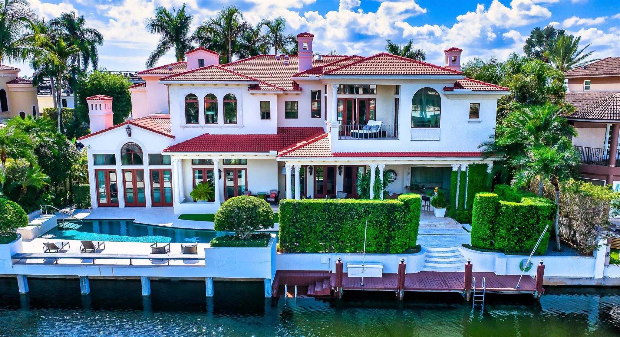 Chic Montecito style meets this Sanctuary deepwater estate sited on 116+/- feet of waterfrontage originally built by Palm Beach builder Addison Development and interiors by Marc-Michaels. Authentic Spanish Colonial influenced interiors boast rich hardwood floors, terra cotta and gorgeous tough and groove beamed wood ceilings and gentle archways sets the stage for glamorous living. Lavish Primary suite includes two baths (one in the new Dior boutique vibe ) , lounge, exercise room and waterway balcony .  Reimaged resort-styled pool/patio is enhanced with water features and sculpture garden, Loggia with professional bar and summer kitchen and Cabana. Shown by appt only. DISCLAIMER: Information published or otherwise provided by the listing company and its representatives including but not limited to prices, measurements, square footages, lot sizes, calculations, statistics, and videos are deemed reliable but are not guaranteed and are subject to errors, omissions or changes without notice. All such information should be independently verified by any prospective purchaser or seller. Parties should perform their own due diligence to verify such information prior to a sale or listing. Listing company expressly disclaims any warranty or representation regarding such information. Prices published are either list price, sold price, and/or last asking price. The listing company participates in the Multiple Listing Service and IDX. The properties published as listed and sold are not necessarily exclusive to listing company and may be listed or have sold with other members of the Multiple Listing Service. Transactions where listing company represented both buyers and sellers are calculated as two sales. Some affiliations may not be applicable to certain geographic areas. /Information published or otherwise provided by seller, listing company or its representatives is deemed reliable but are not guaranteed and subject to errors, omissions, or changes without notice. If your property is currently listed with another broker, please disregard any solicitation for services. Copyright 2024 by the listing company. All Rights Reserved.