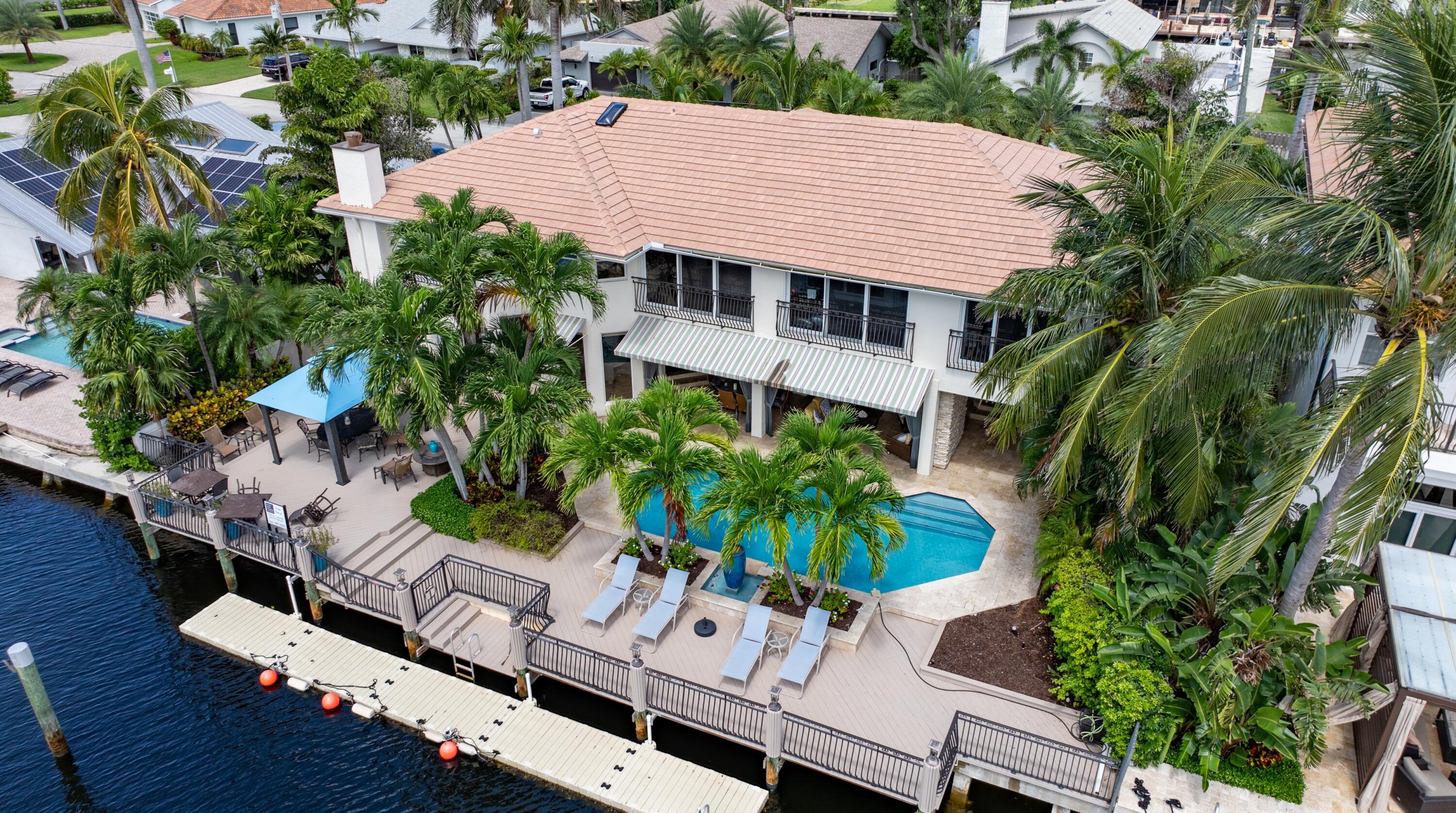 For quintessential indoor/outdoor living for boaters, water-sports enthusiasts and those who love water views, this property presides over 90 feet on a deepwater canal off the Intracoastal with a full-service dock that can accommodate a boat up to 80 feet. The chic residence offers formal living areas, a great room open to the gourmet kitchen, a magnificent water-view primary suite and a gym.

The information herein is deemed reliable and subject to errors, omissions or changes without notice. The information has been derived from architectural plans or county records. Buyer should verify all measurements.

DISCLAIMER: Information published or otherwise provided by the listing company and its representatives including but not limited to prices, measurements, square footages, lot sizes DISCLAIMER: Information published or otherwise provided by the listing company and its representatives including but not limited to prices, measurements, square footages, lot sizes, calculations, statistics, and videos are deemed reliable but are not guaranteed and are subject to errors, omissions or changes without notice. All such information should be independently verified by any prospective purchaser or seller. Parties should perform their own due diligence to verify such information prior to a sale or listing. Listing company expressly disclaims any warranty or representation regarding such information. Prices published are either list price, sold price, and/or last asking price. The listing company participates in the Multiple Listing Service and IDX. The properties published as listed and sold are not necessarily exclusive to listing company and may be listed or have sold with other members of the Multiple Listing Service. Transactions where listing company represented both buyers and sellers are calculated as two sales. "No payments made until title passes" Some affiliations may not be applicable to certain geographic areas. If your property is currently listed with another broker, please disregard any solicitation for services. Information published or otherwise provided by seller, listing company or its representatives is deemed reliable but are not guaranteed and subject to errors, omissions, or changes without notice. Copyright 2025 by the listing company. All Rights Reserved.