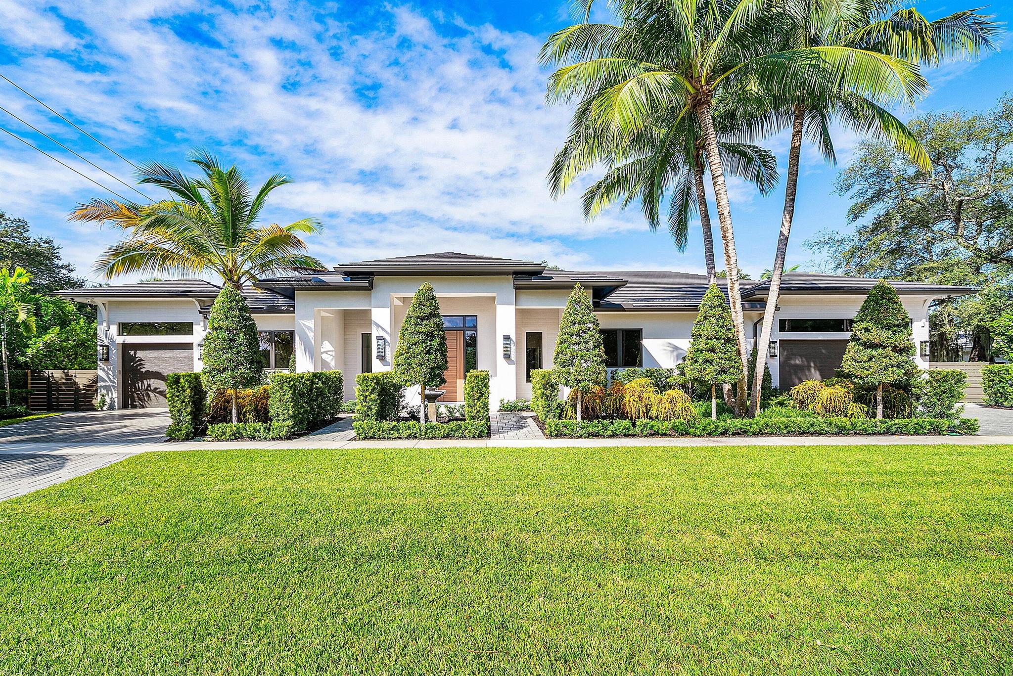 Introducing a Masterfully Crafted Estate That Defines Contemporary Elegance. Perfectly positioned in East Boca Raton's coveted Palm Beach Farms, this stunning one story residence blends architectural sophistication with effortless livability. Expansive, light-filled living spaces flow seamlessly to the outdoors, creating a natural setting for both grand entertaining and intimate gatherings. The great room features a soaring 14-foot ceiling, dramatic Dimplex fireplace, custom wine display, and bar setting the tone for refined yet inviting living. The chef's kitchen showcases top-of-the-line appliances, a generous walk-in pantry, and exquisite craftsmanship that continues throughout the residence. The home features bespoke millwork, designer lighting, and artfully curated finishes that balance modern elegance with warm, livable comfort. Outdoors, a resort-style heated pool with water features, covered summer kitchen, and cabana bath create a private oasis ideal for al-fresco dining and relaxation. Every element of this remarkable home, from its seamless flow to dual laundry rooms and a full-house generator, reflects thoughtful planning and uncompromising quality. Moments from Mizner Park, The Boca Raton, and the area's pristine beaches, this residence enjoys proximity to A+ rated public and private schools, fine dining, and luxury shopping, all within one of Boca Raton's most desirable neighborhoods. A Rare Opportunity to Expand Your Vision, this extraordinary offering also presents the option to acquire the adjoining land parcel, unlocking unlimited potential for an expanded estate compound. Imagine a guest residence, wellness pavilion, sport or pickleball court, car collector's garage, or meditation garden - the possibilities are endless. Opportunities of this caliber in East Boca Raton are exceedingly rare - an exceptional chance to own one of the area's most coveted new-construction estates with the potential to grow into your own private resort retreat. LUXURY. LIFESTYLE. LOCATION. This is East Boca living at its absolute finest.