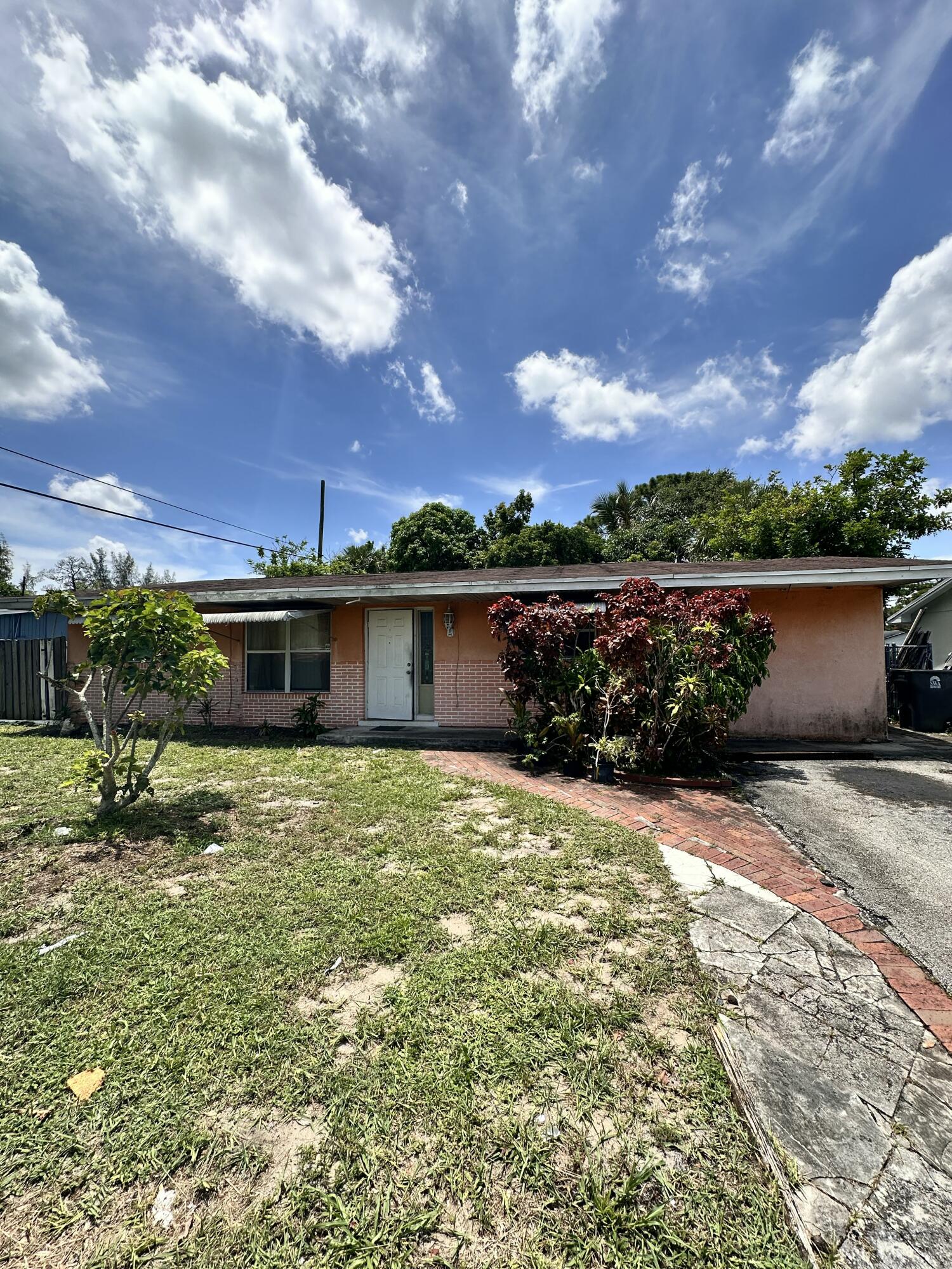 Unleash the full potential of 5612 Souchak Drive—a classic 3-bedroom, 2-bathroom canal-front home waiting for a complete, bottom-to-top transformation! Positioned in one of West Palm Beach's most convenient pockets with ZERO HOA restrictions, this is the ultimate blank canvas for fix-and-flip investors, landlords, or buyers ready to build serious sweat equity.