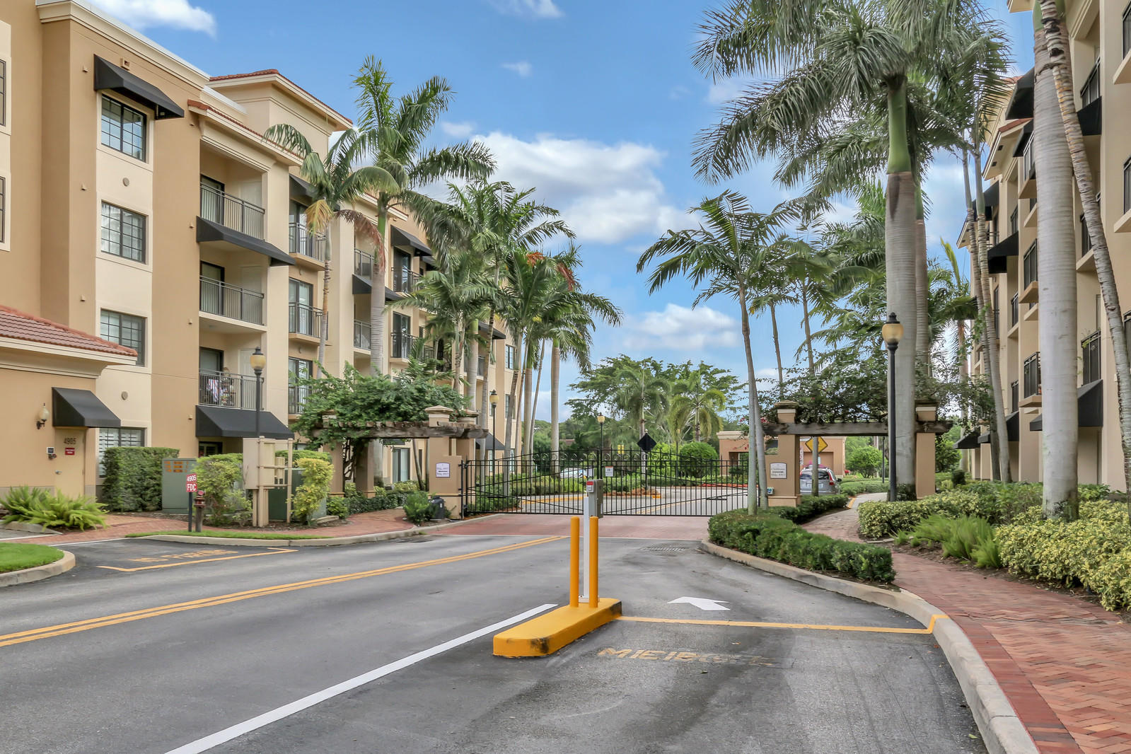 Great buy at Midtown! Luxury Condo in gated enclave tucked away behind the shops and restaurants of Main Street at Midtown. First floor convenience with high ceilings and a large patio with a storage closet. Spacious living area with California Shutters, crown molding and vinyl wood look flooring. Kitchen and bathrooms have been updated with new counter tops, faucets and sinks. AC replaced in 2025. Split bedroom plan with two baths.  Community is pet friendly and has pet walk along the lake.    No worries about storms all impact windows. Community amenities include clubhouse, media room, fitness center, heated pool, spa and tennis/pickleball court. All of this in a walkable location to all of the diverse shopping and dining experiences. I-95 and the Turnpike are close by for each access.