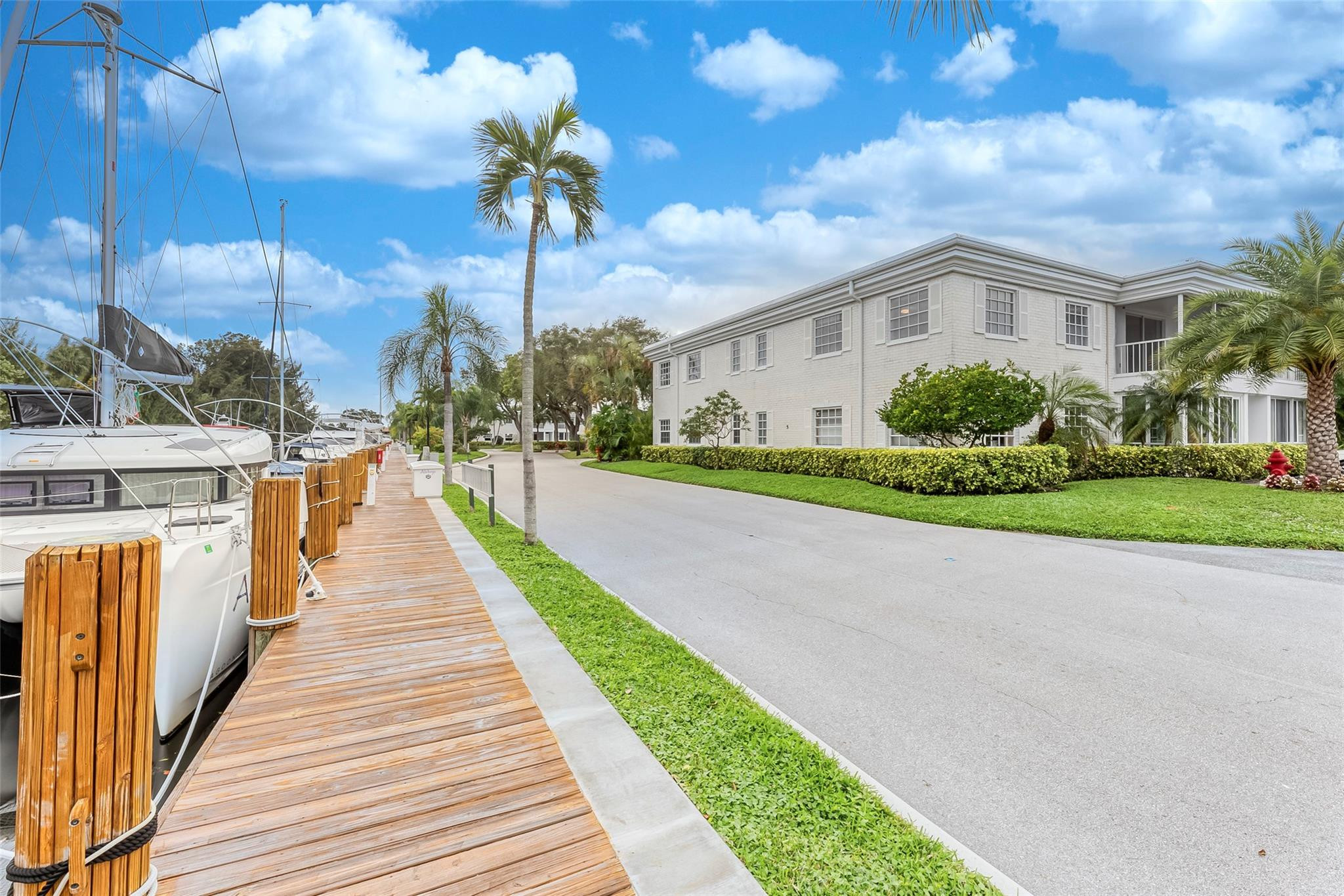 NO FIXED BRIDGES gorgeous WATERFRONT 2nd floor CORNER unfurnished 2 bedroom w/sweeping views of canal and ICW the in beautiful 24-hour guard-gated Bay Colony Club -- Bring your boat up to 50' vessel. Enjoy 4 pools (one on the ICW with bar), outdoor BBQ's, tennis, pickleball, workout rooms, billiards, ping pong, bicycle storage, and a 1.2 mile driveway loop for walking or jogging. This light and bright freshly painted unit features new floors and a peaceful screened lanai. One dedicated parking space right next to the front door & plenty of guest parking available. Basic cable & water are included. NEW ROOF in 2024! Rent right away or move in and live inthe Florida sunshine! Min income & credit score 700. NO ELEVATOR. Rented until 8.20. Call LA for showings.