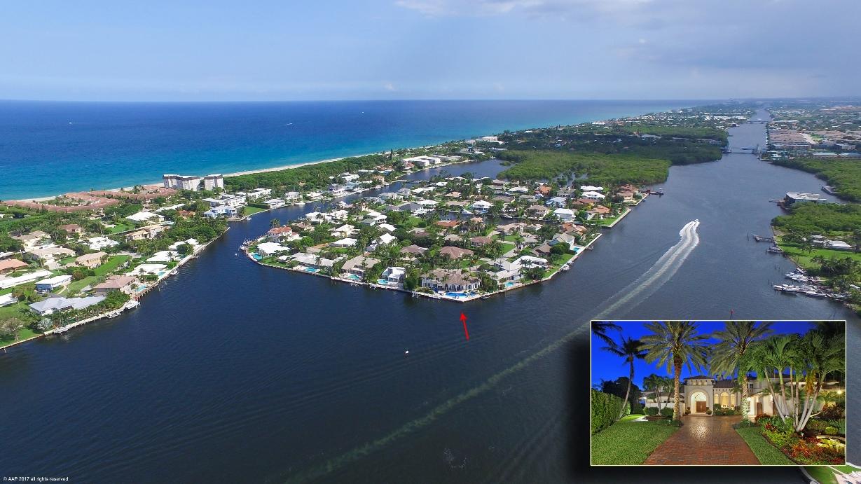 Located on a large 18,000 SF point lot, this beautiful 7400 SF Mediterranean style 5/BR – 6.5/BA residence is perfect for boating and entertaining and assurance of a quiet secure lifestyle in the charming and highly desirable community of Ocean Ridge.
The open floor plan features marble and wood flooring and flows seamlessly from the living room to the den, large family room with fireplace, and a formal dining room. The impact glass windows allow for soft natural light throughout the rooms, as well as for fabulous views of the Intracoastal and beautifully landscaped yard.
The eat-in kitchen has been designed with all the features that a gourmet cook would desire. Among the 5 bedrooms are 2 with Master Baths. The spacious MBR offers fantastic views of the Intracoastal, a walk-in closet and patio access to the pool and dock area.  The Master Baths have dual sinks, separate tubs, large walk-in showers and custom cabinetry.

The beautiful patio area has a summer kitchen with built-in grill, a gorgeous pool with custom rock waterfall bridge all surrounded by mature landscaping.  The property includes over 200 feet of direct water frontage and is located just minutes from the Boynton Beach inlet, a dock with water and electric plus a boat and Jet Ski lift.

Other amenities include a brick-paved circular driveway, an attached garage designed for 2-cars and a separate door for a golf cart.  Located in quiet, secure, upscale Ocean Ridge, you're just minutes away from fabulous shopping and dining in local area shops in the nearby towns of Palm Beach, Delray Beach and Boca Raton.