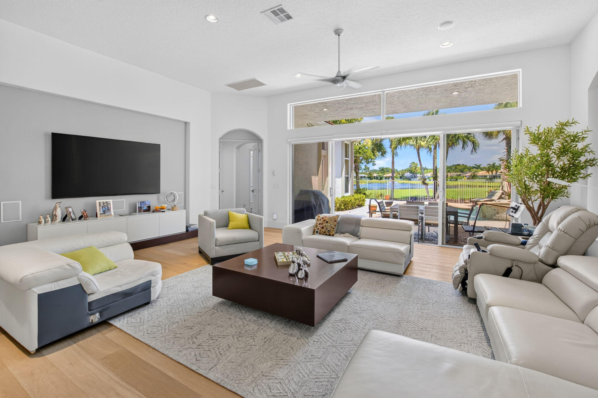 Full Golf Membership available with this beautifully updated 3Br, 3Ba home featuring open floor plan, soaring ceilings, and spectacular golf and lake views. The renovated kitchen opens seamlessly to a spacious great room, perfect for entertaining and everyday living. Updated bathrooms, contemporary finishes,  abundant natural light make this residence truly move-in ready. relax on the lanai or take a dip in your pool or spa, while overlooking the golf course and tranquil lake.