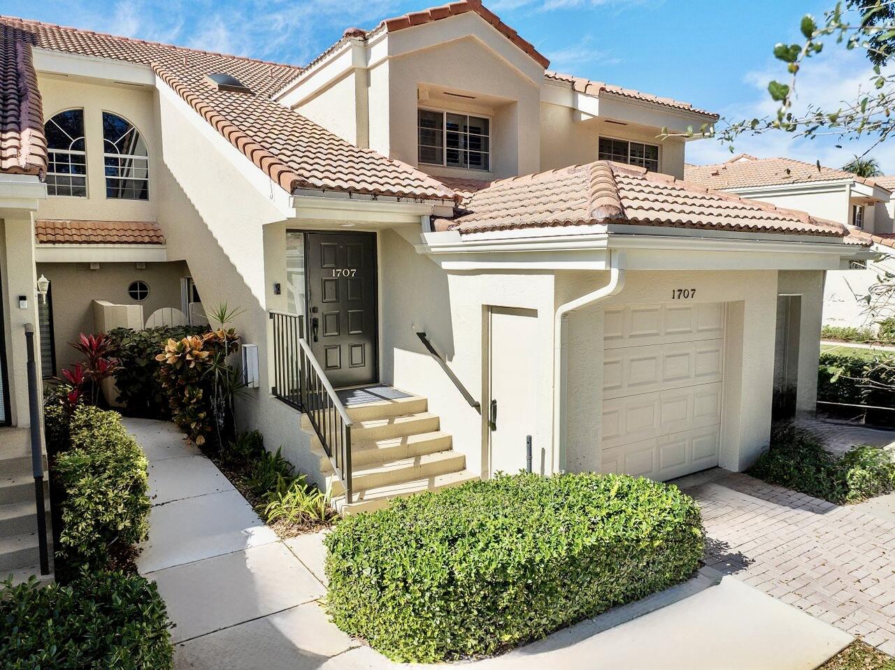 Stunning 3/2 upper CORNER unit with renovated open kitchen in desirable Boca Country Club. All Ages. No Membership Required. This second floor unit overlooks a canal and the golf course! Spacious floor plan. The open kitchen and vaulted ceilings make this condo a dream for entertaining. Eat in your kitchen or your formal dining space. Stainless steel appliances, upgraded cabinets, and granite countertops round out the spacious kitchen. Primary bedroom features water & golf course views with a door out to the patio. Oversized primary bathroom with double sink and separate make-up station. Walk-in closets. 1 car garage. Maintenance Free Landscaping | Community Pool | Hot Tub | Golf Course | Clubhouse | Restaurant | 24-7 Manned Gate & Security | Prime Location | Downtown Boca | Mizner Park | Delray Beach Atlantic Ave | Fine Dining & Shopping | ROOF Covered By Association | Best schools