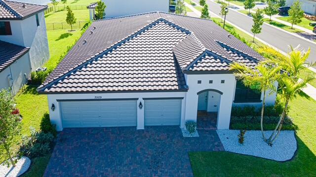 Welcome to this spacious single-story residence in Crestwood North, Royal Palm Beach, offering 2,300 square feet of comfortable living space. This four-bedroom, two-bathroom home provides generous room for various needs, whether for residential living, home offices, or guest accommodations. The three-car garage offers convenient parking and storage solutions for multiple vehicles or equipment. Situated in the Crestwood North community, this property presents a solid foundation for those seeking a well-proportioned single-story residence with practical amenities and straightforward appeal.
