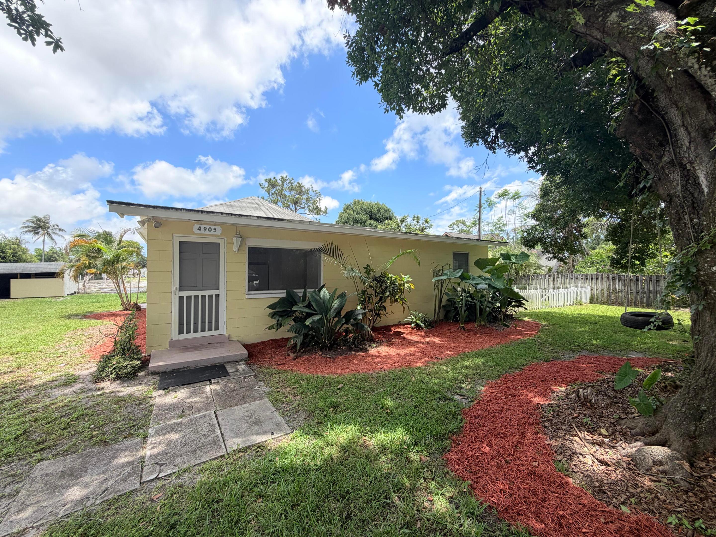 Nestled in the highly sought-after Highland Pines neighborhood, this charming cottage-style home sits on a spacious ¼-acre lot with no HOA and endless possibilities. Plenty of room to add a pool, expand the existing home, build a guest house, garage, studio apartment, or create your dream backyard oasis. Bring your boat, RV, commercial vehicles, and trailers with no HOA restrictions. Located in a quiet neighborhood with nice neighbors and country-style charm right in the middle of the city, this property offers incredible flexibility and investment potential.  This home can function as a single-family residence, duplex-style setup, or income-producing property. The primary suite features its own private entrance and bathroom, creating the opportunity to rent the home as a 2-bedroom/1-bath Nestled in the highly sought-after Highland Pines neighborhood, this charming cottage-style home sits on a spacious ¼-acre lot with no HOA and endless possibilities. Plenty of room to add a pool, expand the existing home, build a guest house, garage, studio apartment, or create your dream backyard oasis. Bring your boat, RV, commercial vehicles, and trailers with no HOA restrictions. Located in a quiet neighborhood with nice neighbors and country-style charm right in the middle of the city, this property offers incredible flexibility and investment potential.  This home can function as a single-family residence, duplex-style setup, or income-producing property. The primary suite features its own private entrance and bathroom, creating the opportunity to rent the home as a 2-bedroom/1-bath and separate 1-bedroom/1-bath setup, or as a full 3-bedroom/2-bath home. Lease immediately after purchasing with no rental restrictions, making this an amazing opportunity for investors, Airbnb potential, or multigenerational living.  Inside, the home is bright and spacious with a great layout and flow, filled with natural light throughout. Features include tile flooring throughout, vaulted ceilings, shiplap tongue-and-groove wood ceilings with crown molding in the second bedroom, crown molding in the third bedroom, ceiling fans with lighting, and plenty of closet space. The primary suite offers French doors leading to the patio, while the second bedroom also has sliding glass doors to the outdoor space. Washer and dryer are conveniently located inside the home. CBS construction with a 2011 roof adds peace of mind.  This property is truly a blank canvas waiting for its new owner to renovate and customize to their own taste and style. Incredible equity appreciation opportunity with neighboring comparable properties within a half-mile selling in the $1M+ range. Perfect for a buyer looking to renovate and flip, expand, or hold as a long-term investment. The fully fenced yard with lush landscaping offers plenty of room for pets, children, gardening, or entertaining.  Located right off Northlake Boulevard near Military Trail, this prime location is close to Publix, shopping, restaurants, cafes, hospitals, and major highways, while being only a short drive to the beach, Palm Beach International Airport, and just minutes from PGA National Resort. Situated within an A-rated school district, this property offers location, flexibility, and opportunity all in one.
