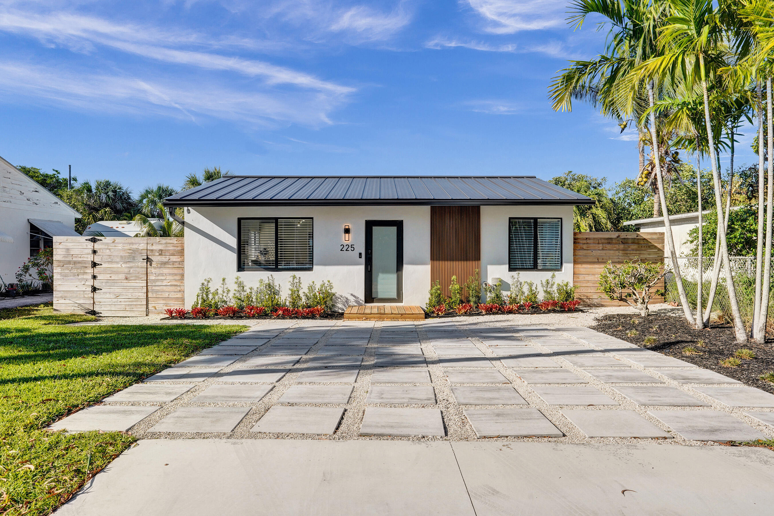 Turnkey living in the heart of Delray Beach! This beautifully furnished, newly renovated 4BR/3BA pool home offers the perfect blend of comfort, style, and investment potential. The main house features a spacious master suite with en suite bath, two additional bedrooms connected by a Jack-and-Jill bath, two living areas, and a fully equipped kitchen with in-unit washer and dryer. The private 1-bedroom guest house includes its own full bath, kitchenette, sitting area, and washer and dryer — ideal as a mother-in-law suite or income-producing rental. All impact windows and doors, new roof, and sold fully furnished with stylish, coastal-inspired décor throughout. Step outside to your own backyard oasis — heated pool, outdoor dining, and a backyard perfect for entertaining. NO HOA.