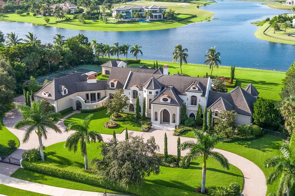 Welcome to Chateau Ami, a magnificent estate set on 2.5 acres with the longest lake view in the community, maximum privacy, space and luxurious amenities all on your own private grounds. A spacious home office with stunning lake views, fully-equipped home theatre, gym, state of the art lighting, security and music systems optimize comfort. The oversized infinity pool & outdoor Jacuzzi, covered summer kitchen, tennis court and putting green are perfect for outdoor recreation. A customized climate-controlled 4-car garage will satisfy even the most discerning car enthusiast. Guests and staff enjoy privacy in the separate guest house with a full kitchen and separate servant wing. Hurricane impact glass and a whole house generator ensure protection and comfort in any weather. Come see this magnificent estate with exquisite artisan details and European flair and craftsmanship. Inspired by the splendid and romantic chateaus of France, this lavish estate is an extraordinary luxury retreat melding European sophistication with timeless architecture, while offering everything the 21st century has available in convenience, comfort and technology. The ornate automatic gates open to welcome you to the home of your dreams. Sprawling entertaining spaces flow to the outdoor living room, past the tennis courts and guest house to the stunning infinity pool with a programmable color fiber optic lighting system, and the tranquil lake beyond. Upgrades include, but are not limited to, breathtaking new landscape design, new interior/exterior paint, new electronics, and a 150kw generator capable of powering the entire home! Set on 2 and a half acres of premier lakefront, this residence is the creme de la creme in prestigious Stone Creek Ranch Estates. Chateau Ami in coveted Boca/Delray is a sprawling spa-like oasis. 

Renowned architect Randolf Stofft & Cudmore builders have created a masterpiece of meticulous design and craftsmanship, featuring rare custom amenities including inlayed onyx, hand-planed hickory wood floors, intricate hand-painted ceilings (with a 30 ft dome in the grand entrance hall), custom crown moldings, arched windows & doors, a hand-carved fireplace by Barbara Tattersfield, onyx, granite and marble flooring & countertops, gorgeous crystal chandeliers, and an opulent iron stair railing leading to the upstairs. The entire home is customized with intricate 24k gold leaf design elements on the walls and ceilings. You will also appreciate the floor-to-ceiling custom wood built-ins, custom bar in the study /library, huge walk-in wine cellar (BYOB), and private elevator to transport you to the 2nd floor where you can sip that wine and enjoy a good book in the reading nook that peers out to the stars above. 

Set on 2.5 acres of premier lakefront acreage, this grand French Chateau is at the apex of quality and design among the 37 residences in this prestigious community, offering blissful private grounds and the longest lake view in the community. The pristine property has been extensively re-landscaped at a cost exceeding $150k, making it perfection in every detail. Nighttime is especially magical with the newly-installed ground lighting system to truly enhance the ambiance. 

With fresh paint inside and out, and the tennis courts resurfaced, no detail has gone untended. Additional upgrades include all new electronics, a new pool and pool equipment, and a 2nd backup generator ensuring backup power in the event of an outage. Entertain elaborately in the dramatic living room with coffered ceilings, regal formal dining room and large family room with vaulted wood ceilings. Hand-painted rare hickory wood floors in the family room and kitchen afford an inviting French country feel. The chef's dream kitchen is equipped with 3 Wolf ovens, 2 dishwashers, a built-in Miele espresso maker and butler's pantry. The luxe master suite is indulgent with a sitting room, huge custom walk-in closets, his/her bath with steam showers and hers pink onyx bath & Jacuzzi, as well as an enormous chandeliered walk-in closet, newly painted with new floor covering. 

A fully-equipped home theatre, gym, state of the art lighting system and security and music systems optimize comfort. The oversized infinity pool & outdoor Jacuzzi, covered summer kitchen with wood ceiling, tennis court and putting green are perfect for outdoor recreation. A customized climate-controlled 4-car garage will satisfy even the most discerning car enthusiast. The whole estate has been meticulously maintained by a full-time housekeeper and property manager, making it move in ready. Guests and staff enjoy privacy in the separate guest house with a full kitchen and separate servant wing. Hurricane impact glass windows ensure protection from even the harshest weather. 

Nestled amid 187 acres of breathtaking rolling greens and tree-scapes with sparkling lake views, Stone Creek in Delray Beach is an exclusive sought-after residential community near the area's best attractions, minutes from FL's Turnpike and I95. Come home to your Chateau today! 

*Sliding scale commission, ask listing agent for details or see brokers remarks*