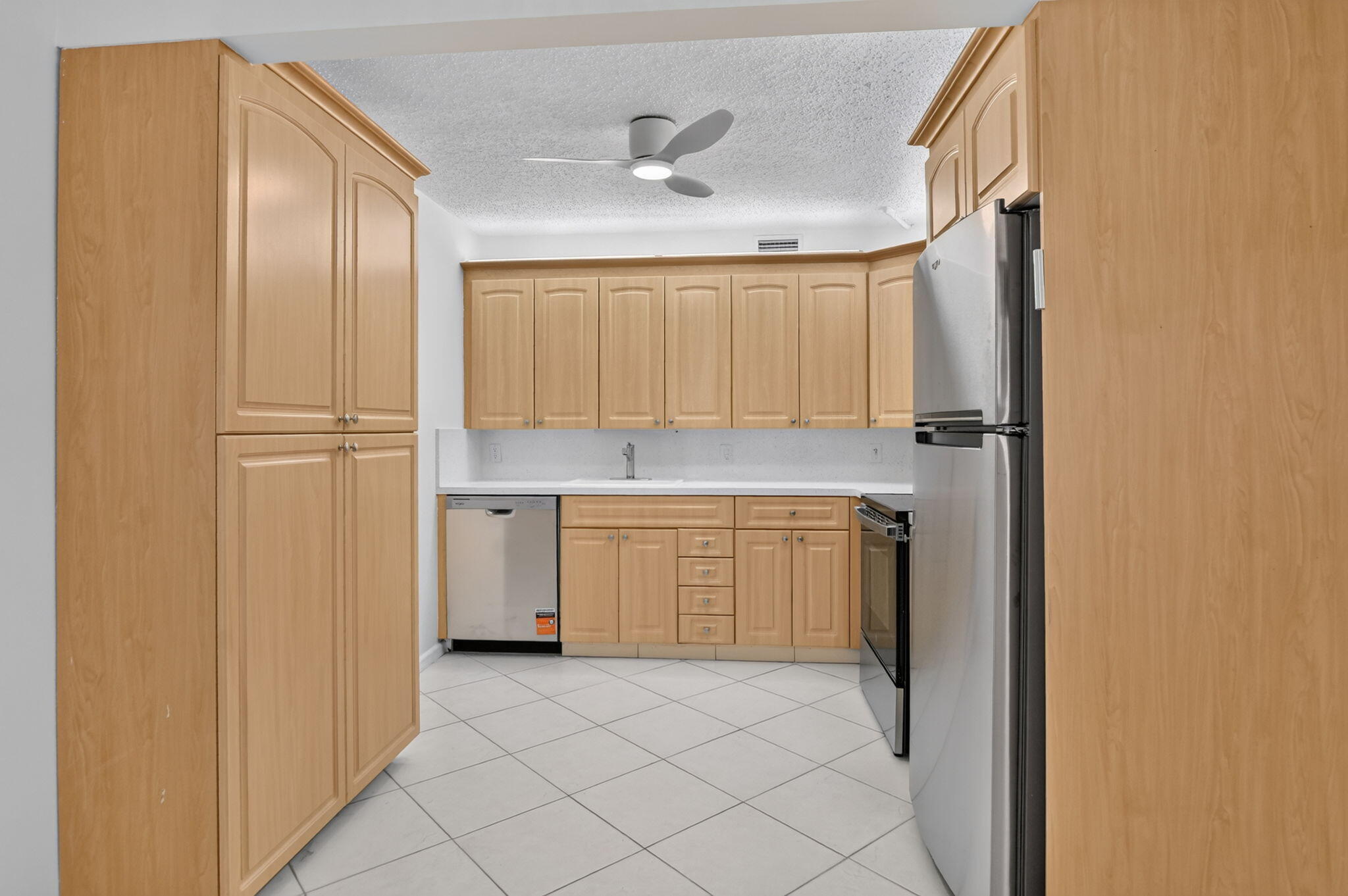 Light and Bright 2-bedroom, 2-bathroom condo on the 3rd floor, offering breathtaking, panoramic lake views. This unfurnished home features beautiful tile flooring throughout and an updated kitchen complete with new appliances and extra cabinet space. Both bathrooms are updated, and the brand-new A/C ensures year-round comfort. Step out from your primary suite onto an enclosed, sliding-window patio—the perfect spot to relax and take in the scenery. , Close to house of worship and clubhouse.  Century Village is like living in a resort, fitness center, live shows,movies,buses,classes,bingo,card rooms,trips,tennis,pickleball,close to shopping and restaurants,come see and then check out the clubhouse to see it for yourself. Per the association this is a 55 plus community!!! THIS IS A MUST SEE !