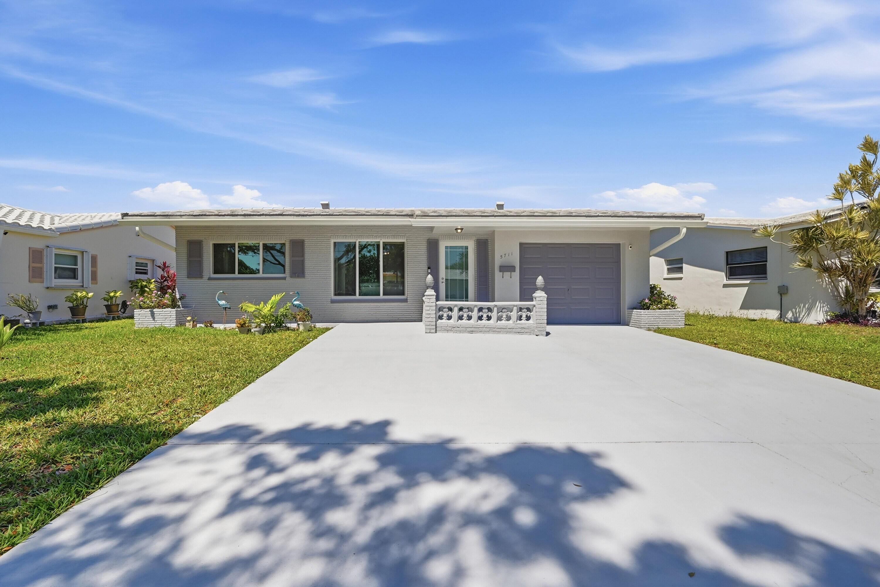 Beautifully renovated Tamarac gem! This charming 2-bedroom, 1-bath home features impact windows throughout, updated finishes, and 1 car garage.  Spacious driveway accommodates up to 3 vehicles.  Move-in ready with a bright and open layout and great outdoor space perfect for relaxing or entertaining.  Conveniently located near shopping, dining, parks, and major highways.